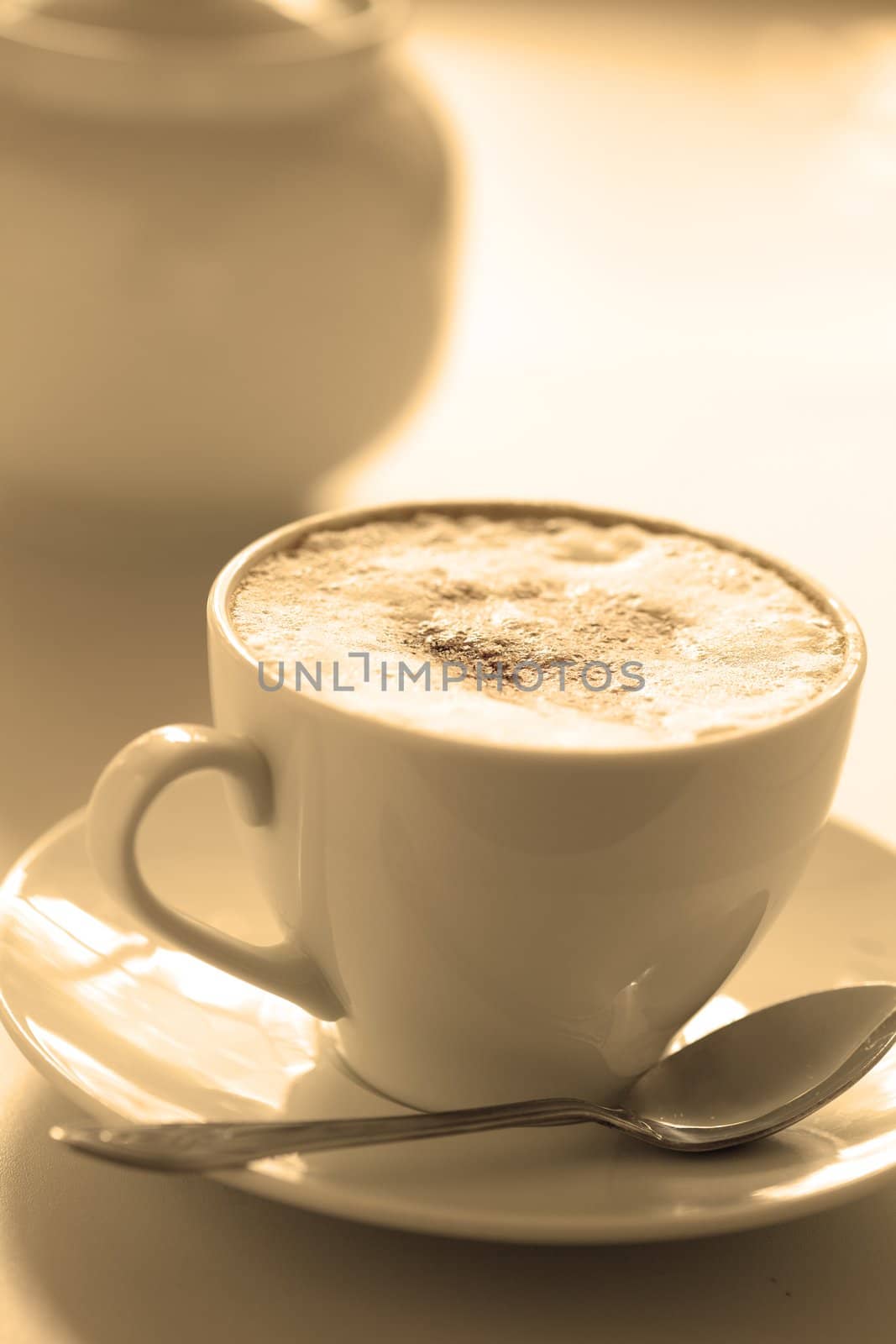 Cup of hot cappuccino, close-up. At the bottom  copyspace. Image tinted
