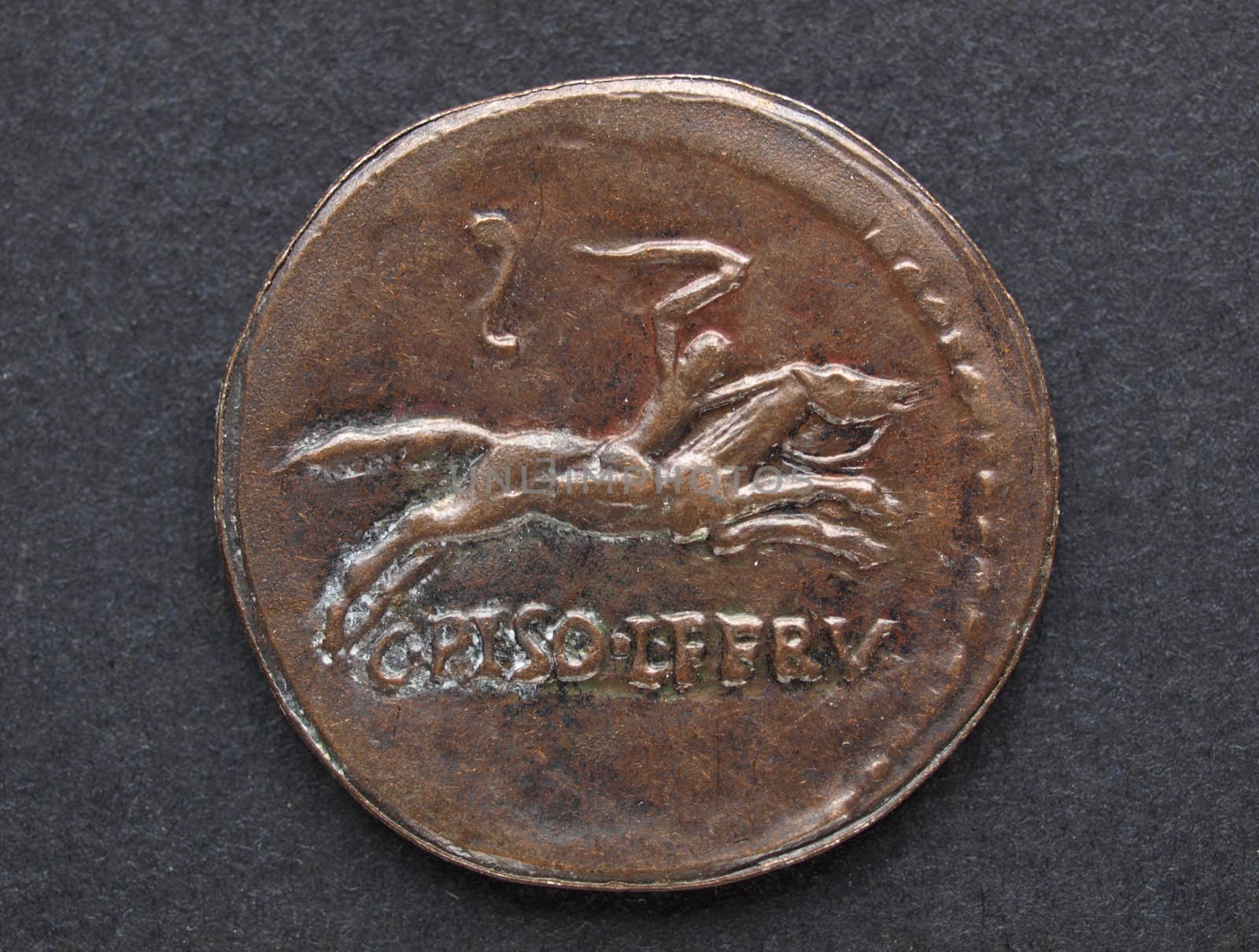 Ancient Roman coin on a black background