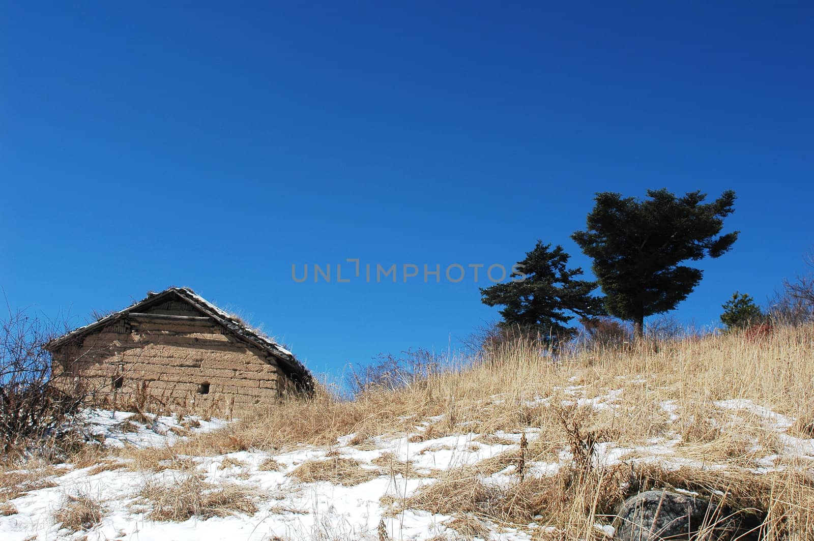 Landscape of a hut on the top of mountains in winter