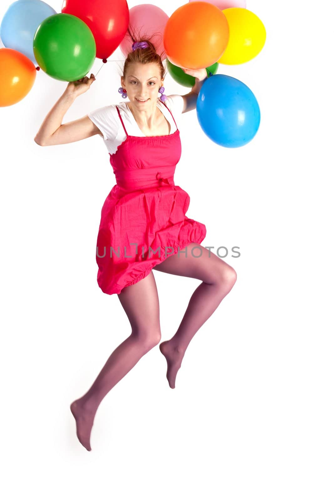 people series:  young girl jumping with multicolored balloons