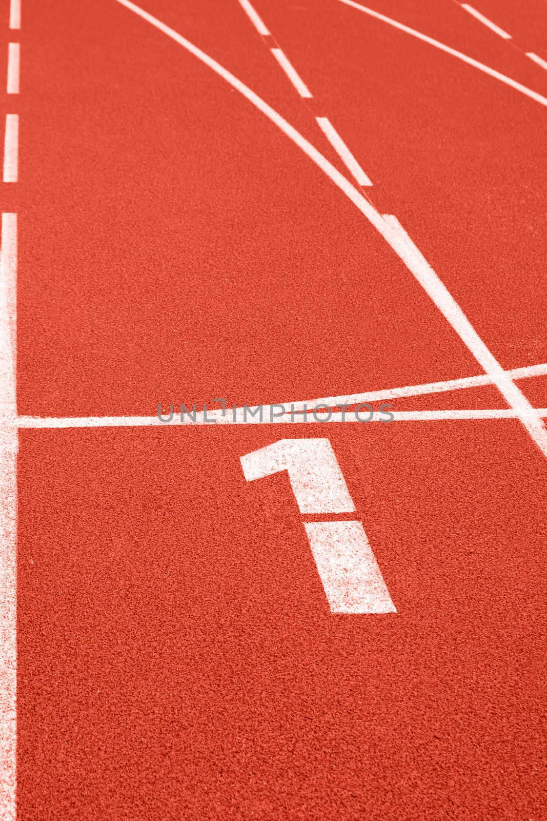 Close up of numbers on red running track.