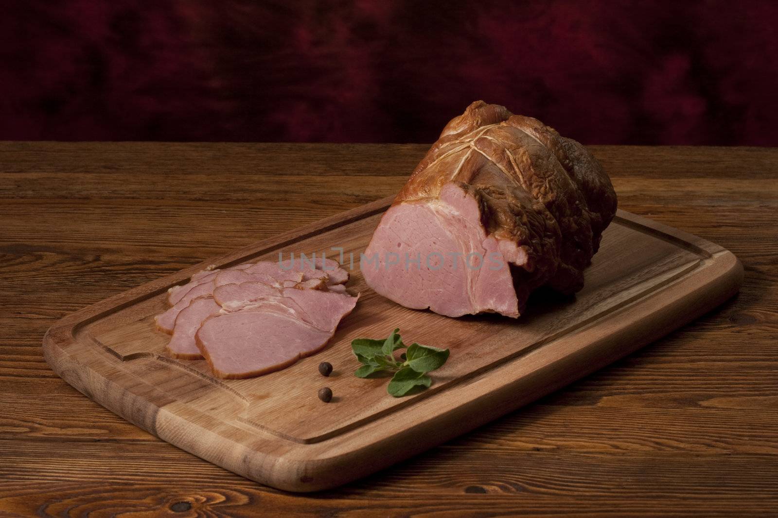 Smoked ham on the table by igor_stramyk