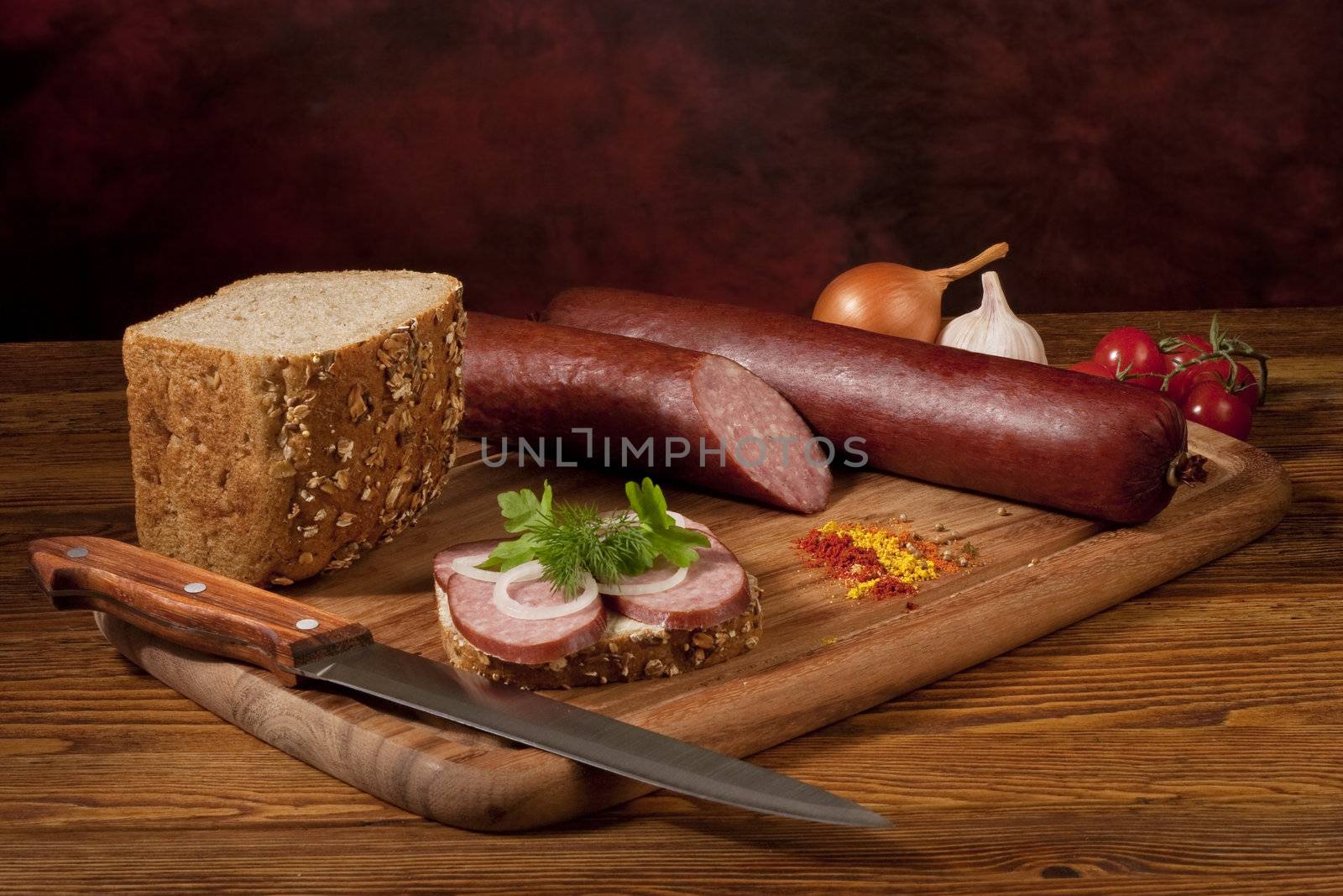 Composition with sausage on the table