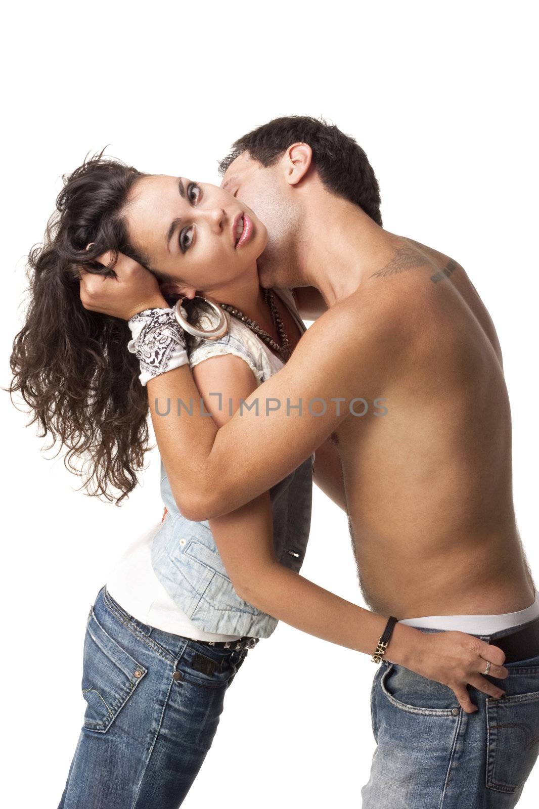Man embrace his girlfriend and kiss in the neck