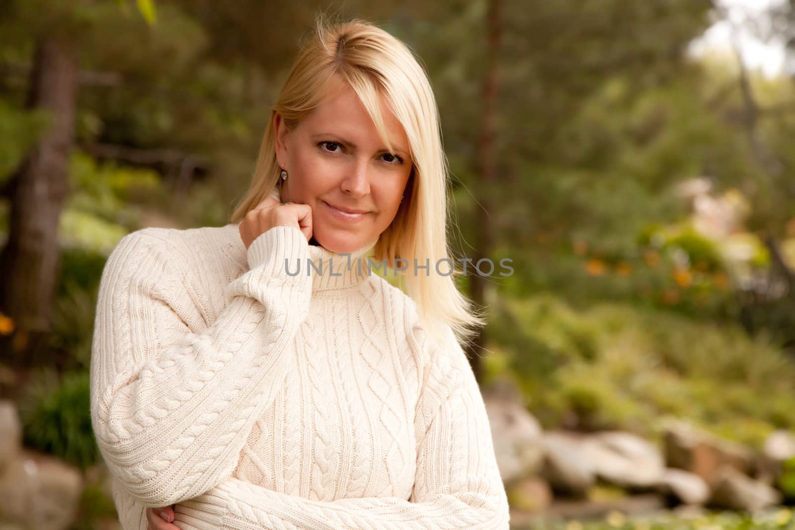 Attractive Blonde Woman Portrait in the Park.
