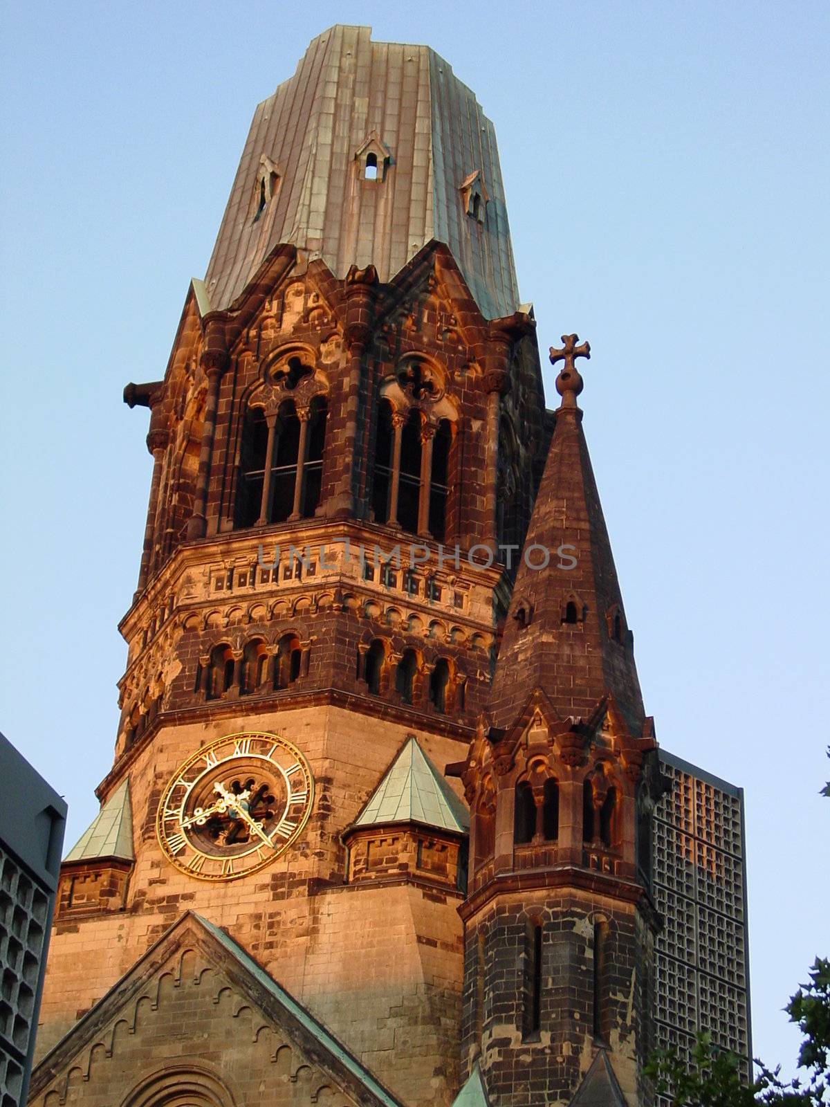 The clock and bell tower Memorial Church in Berlin, Germany that was bombed in world war 2 and stands as a memorial.