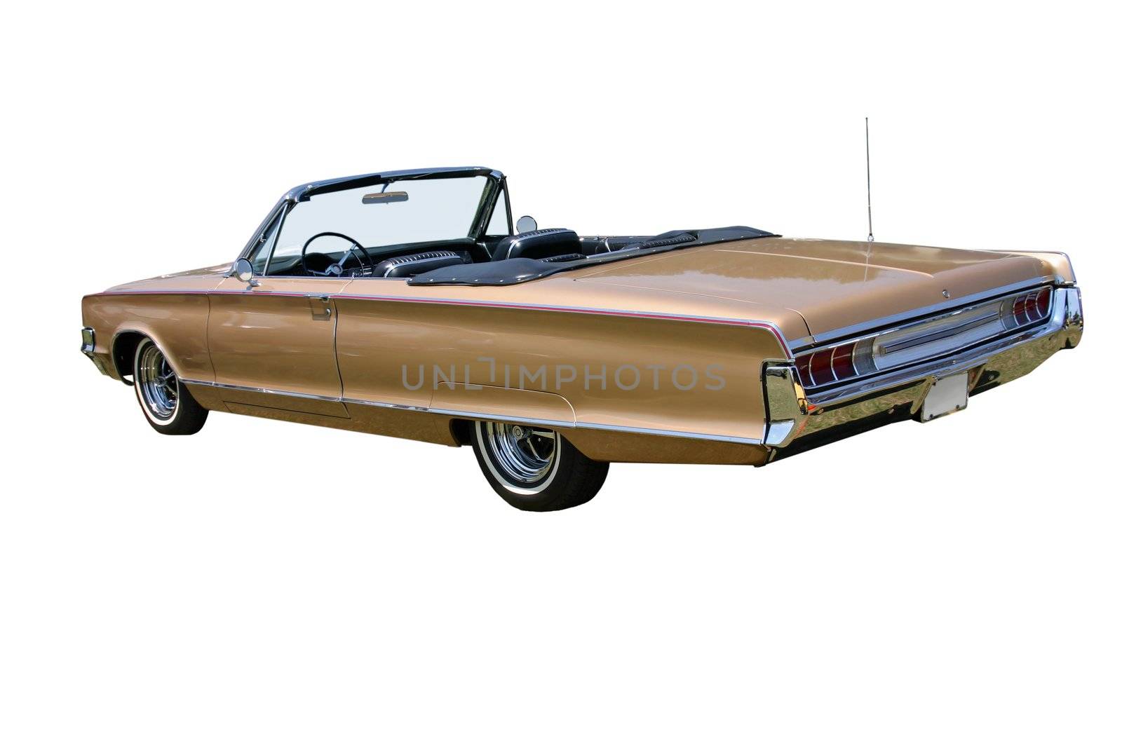 This is a picture of a 1960s convertible car with the top down and facing the rear corner, it is isolated on white. 