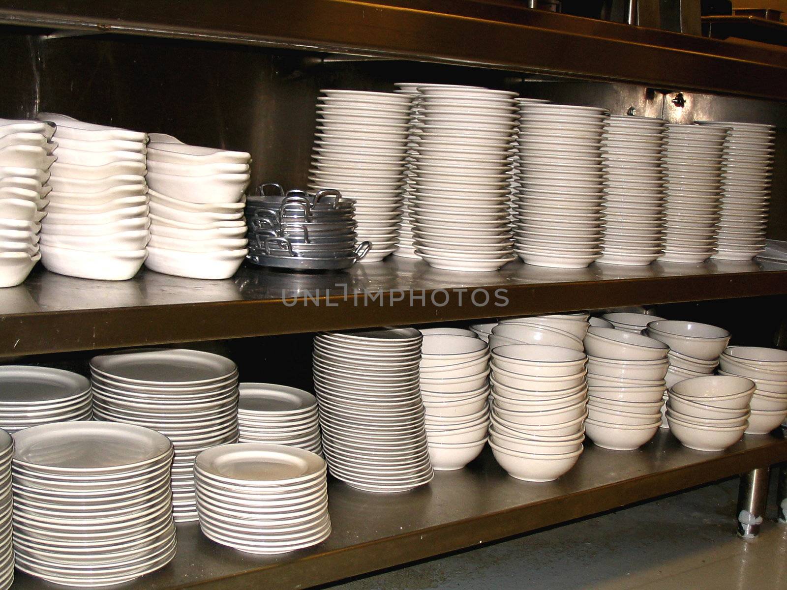 This is a picture of dishes in a restaurant ready for the cook to fill with the daily special, and send off to waiting customers. 
