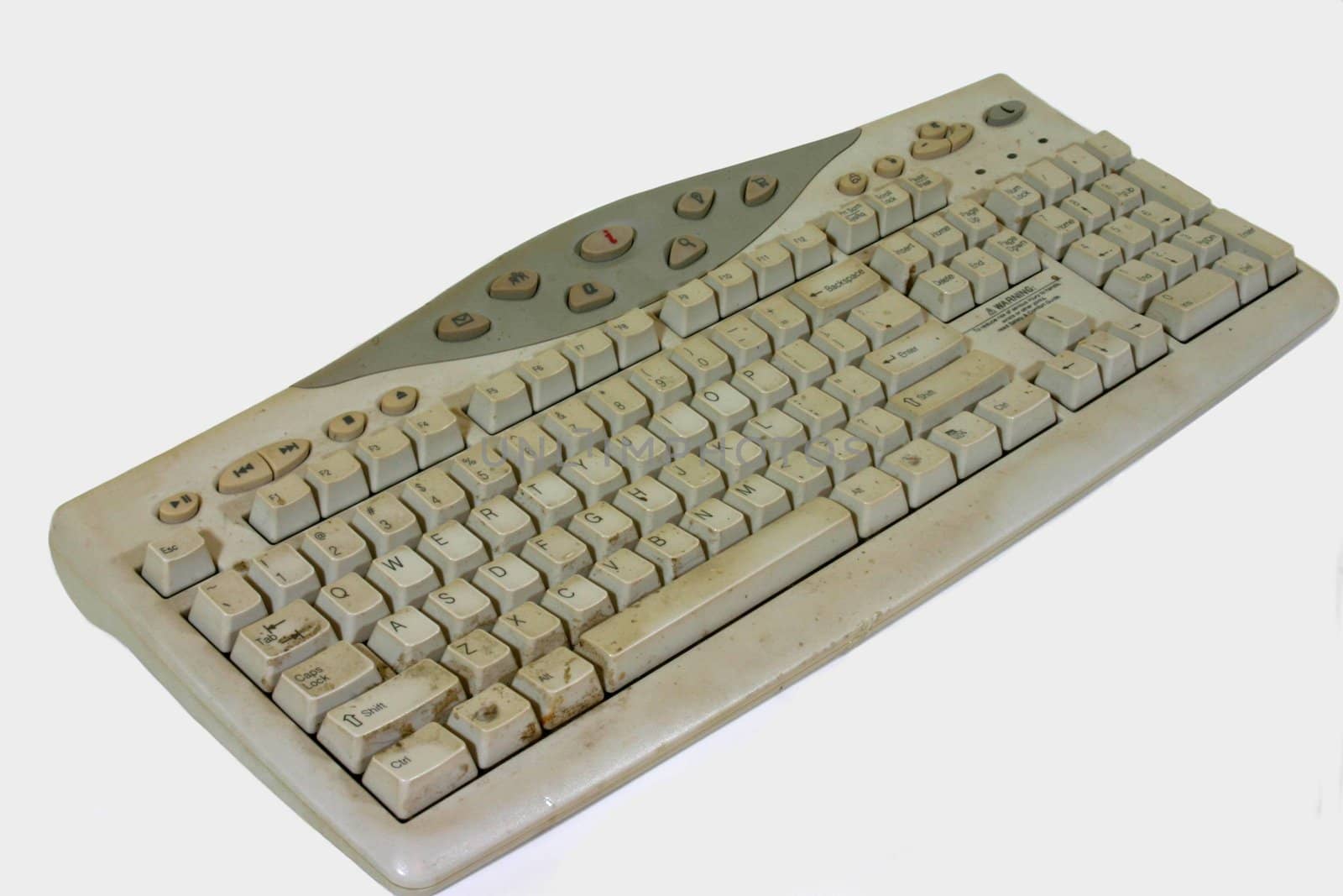 This is a computer keyboard covered in grime and filth, isolated on white.