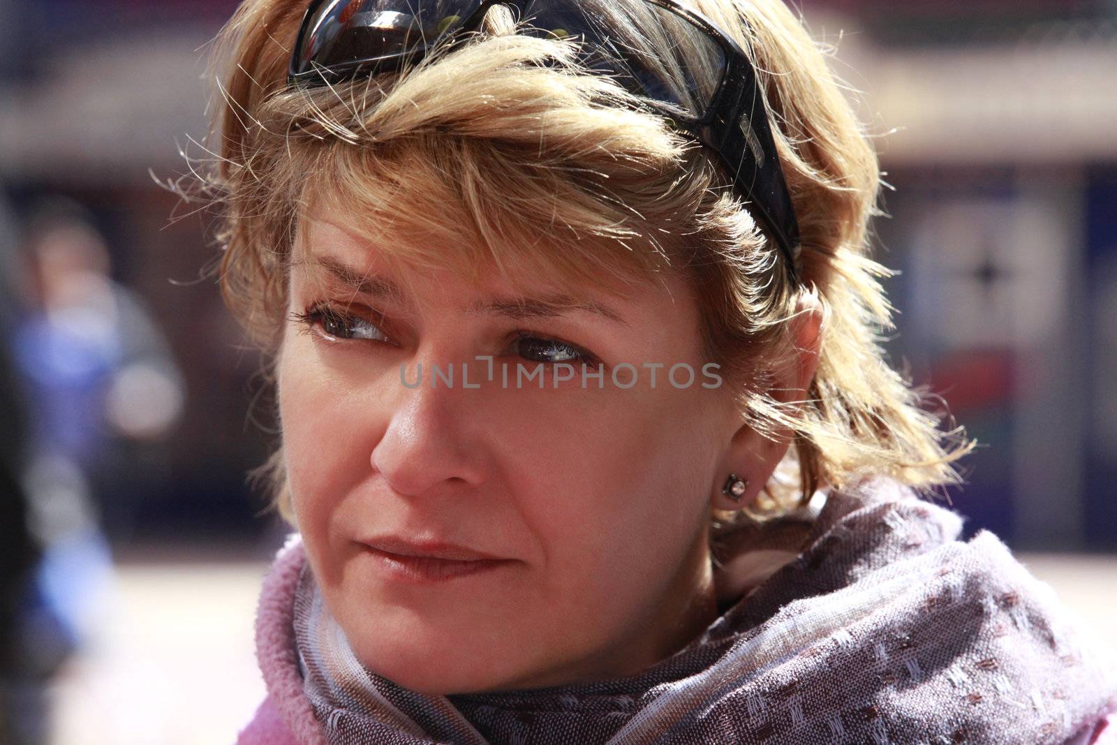 Casual portrait of the thoughtful woman in cafe