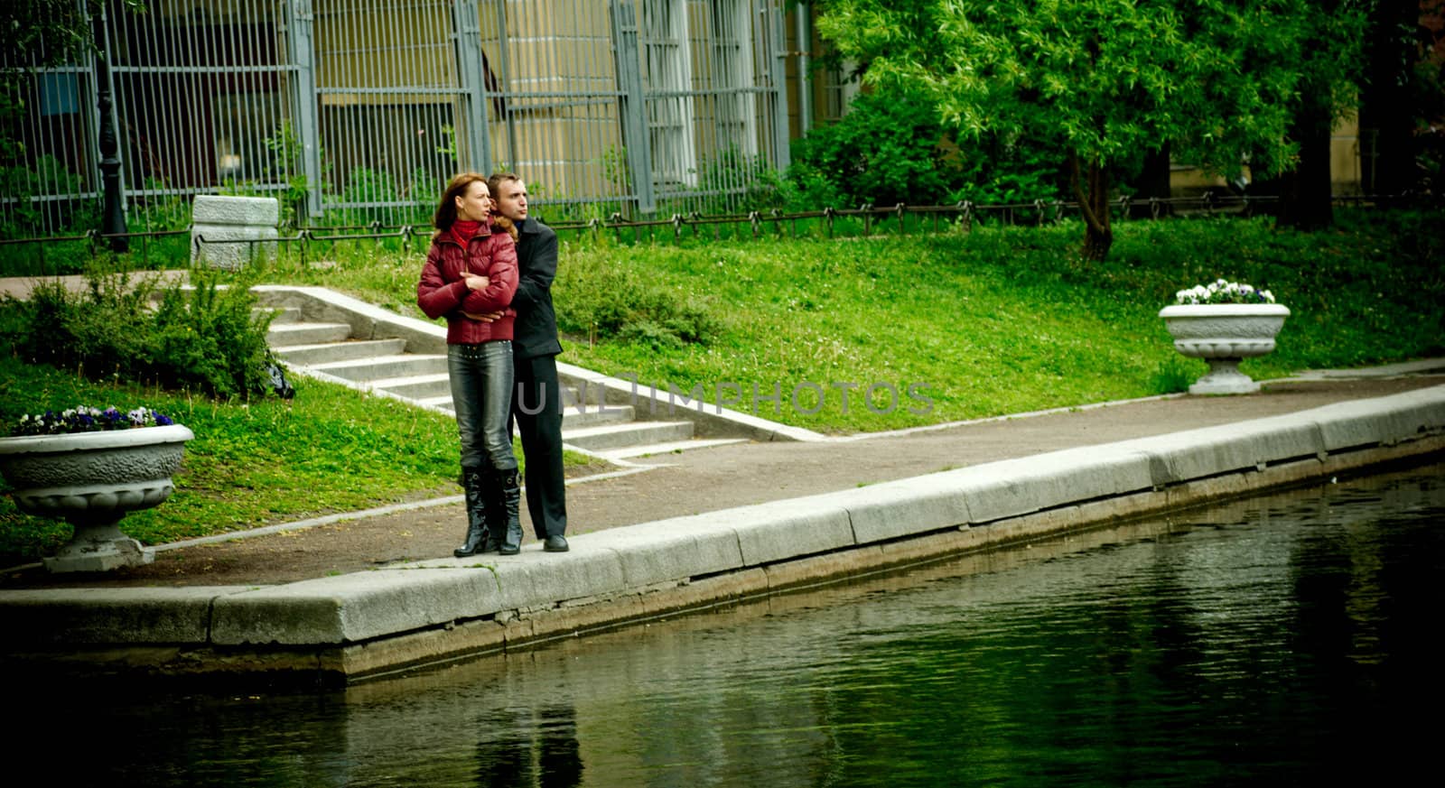 Happy young couple enjoying each other in park 