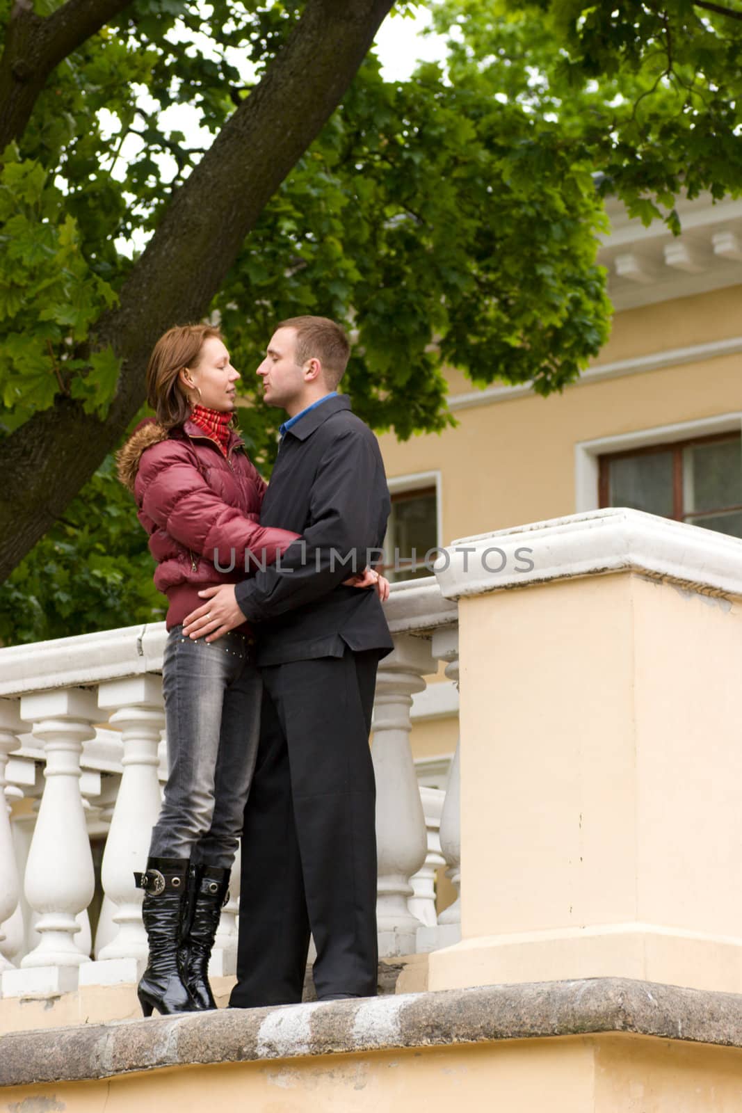 Talking couple standing together outdoors in spring