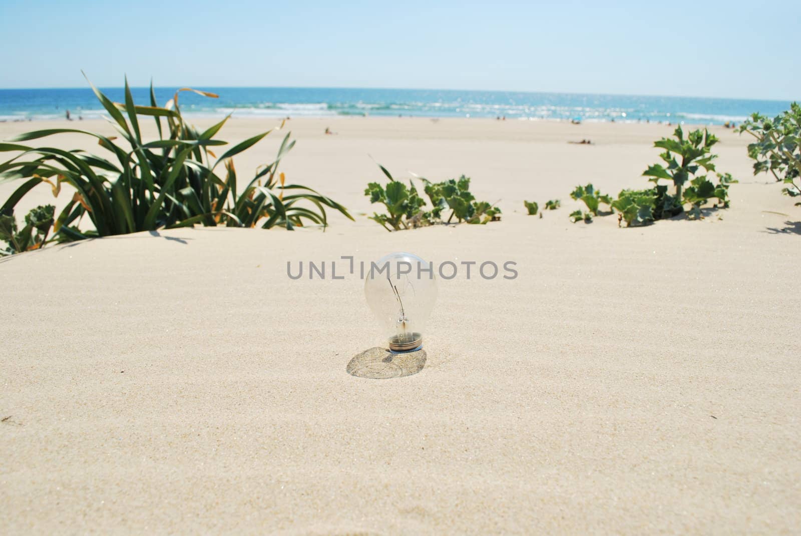 Lightbulb on sand (global warming) by luissantos84