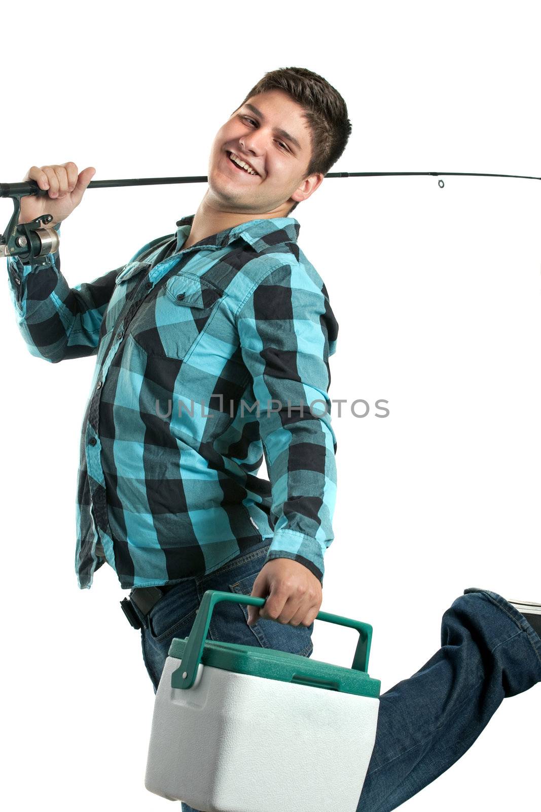 A young man poses with his fishing reel and beer cooler isolated over a white background.