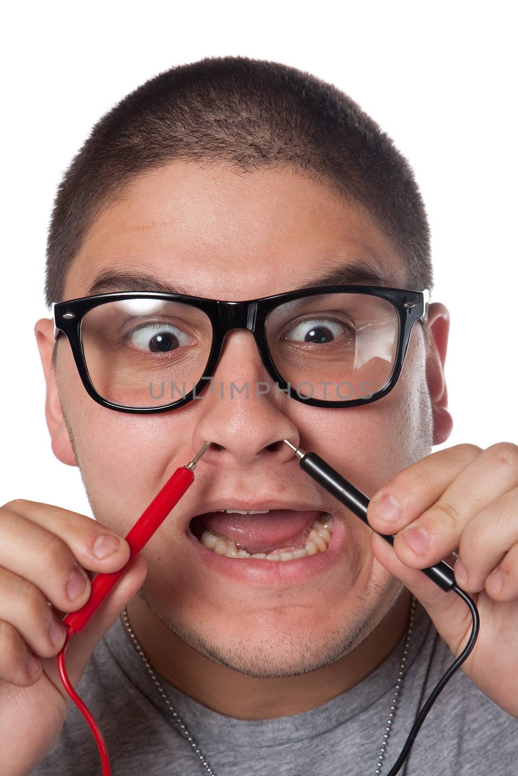 A goofy man wearing trendy nerd glasses isolated over white with a funny expression on his face.