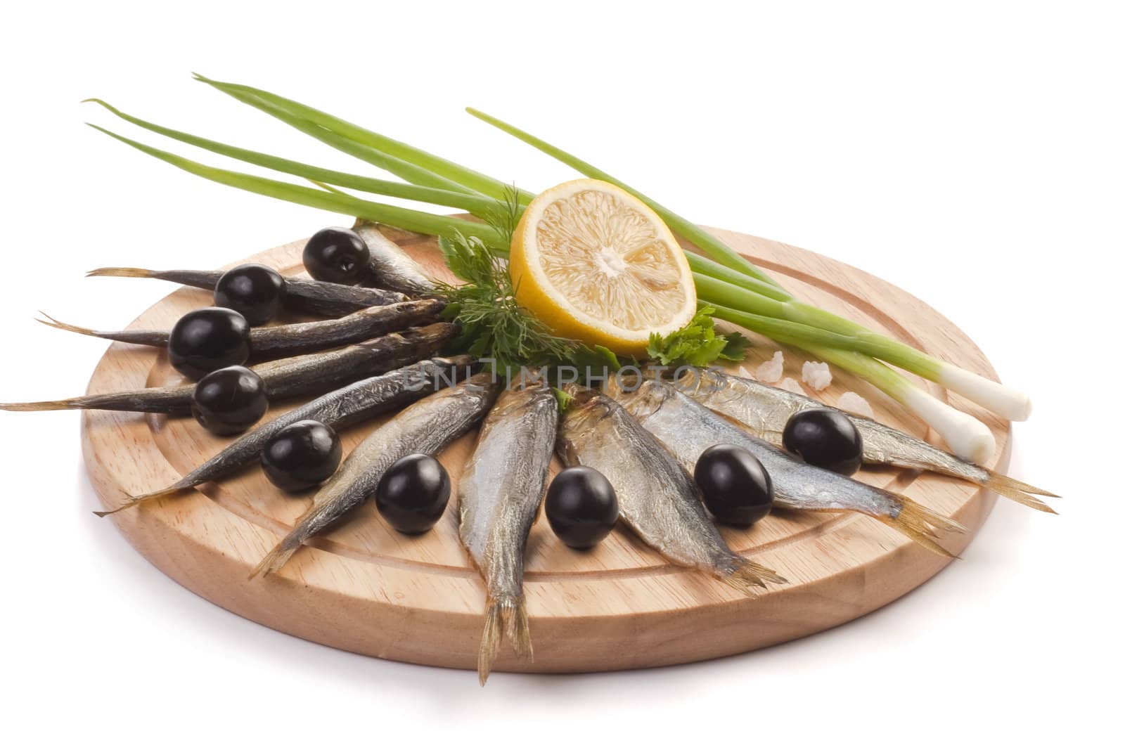 A composition with smoked clupea herring fish (Clupea harengus membras) on wooden plate isolated on white