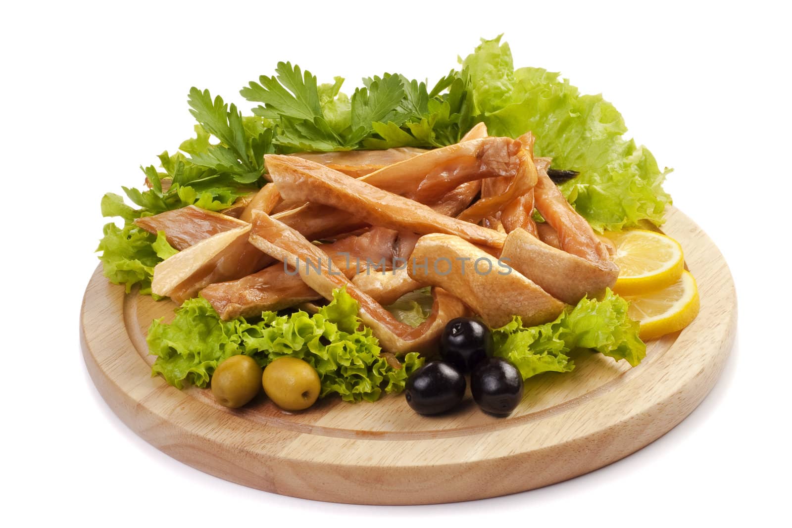 A composition with smoked salmon bellies on wooden plate isolated on white