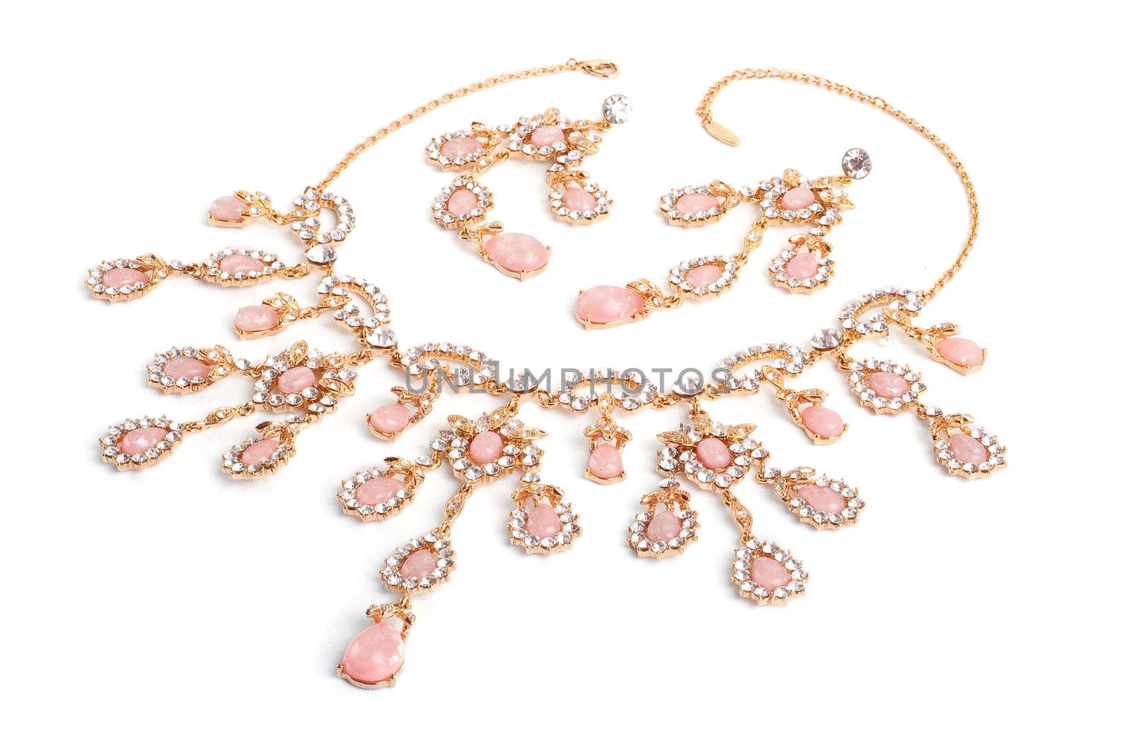 Diamond pendant with pink gems isolated on white
