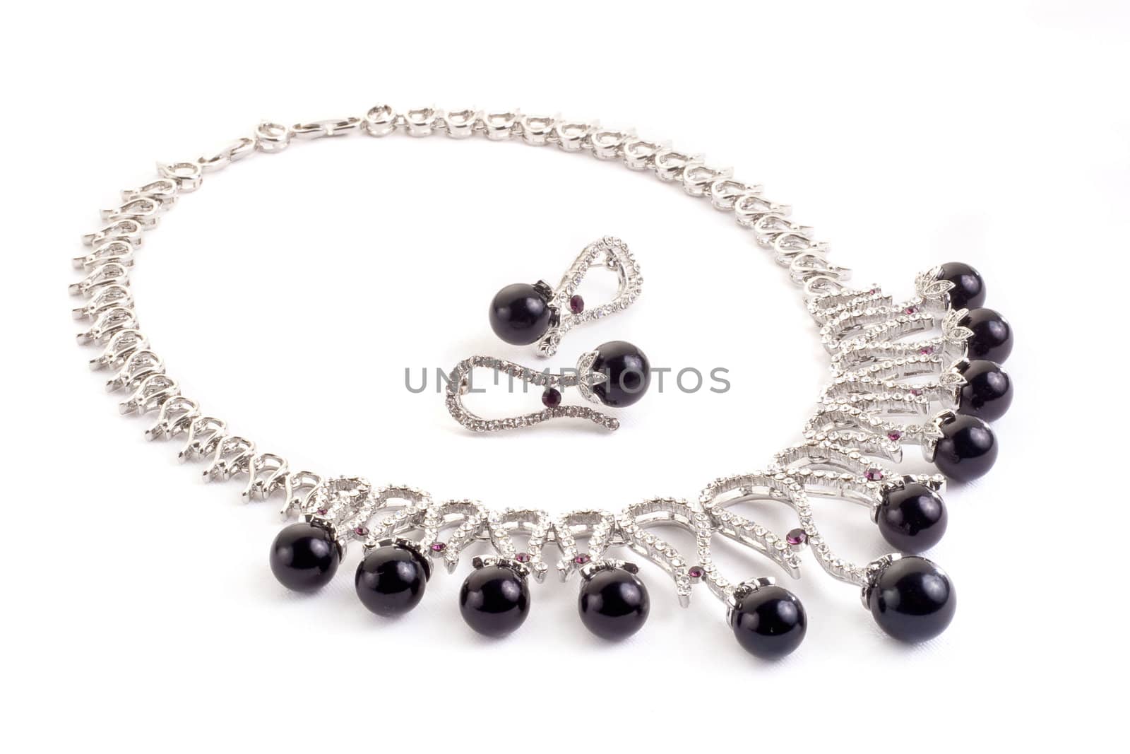 Necklace with black pearls on a white background