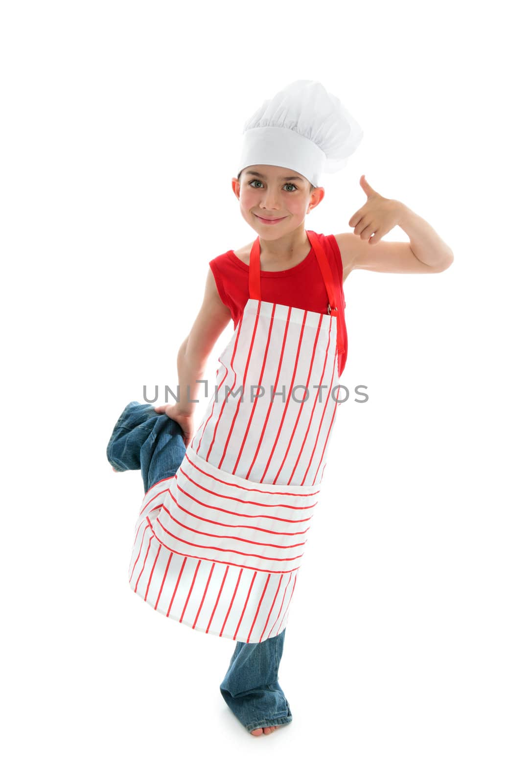 A young child chef wearing a red and white striped apron and white chef hat smiling and thumbs up   White background.