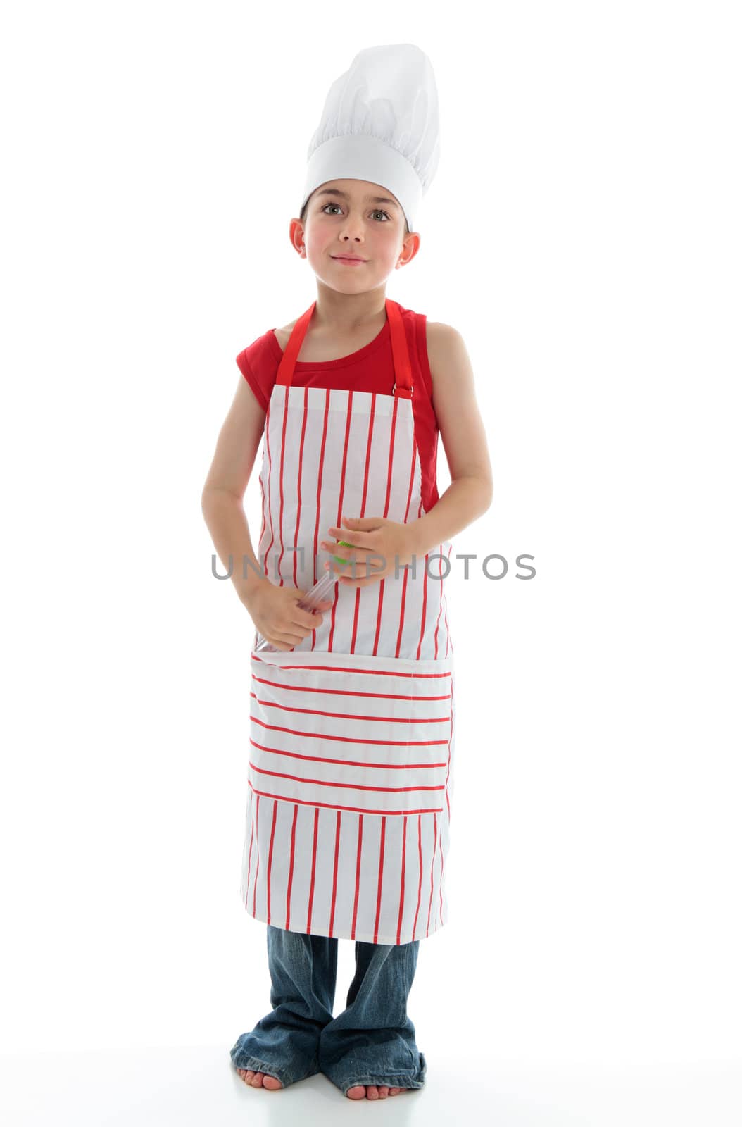 A young chef standing and pondering.  Standing on a white background.