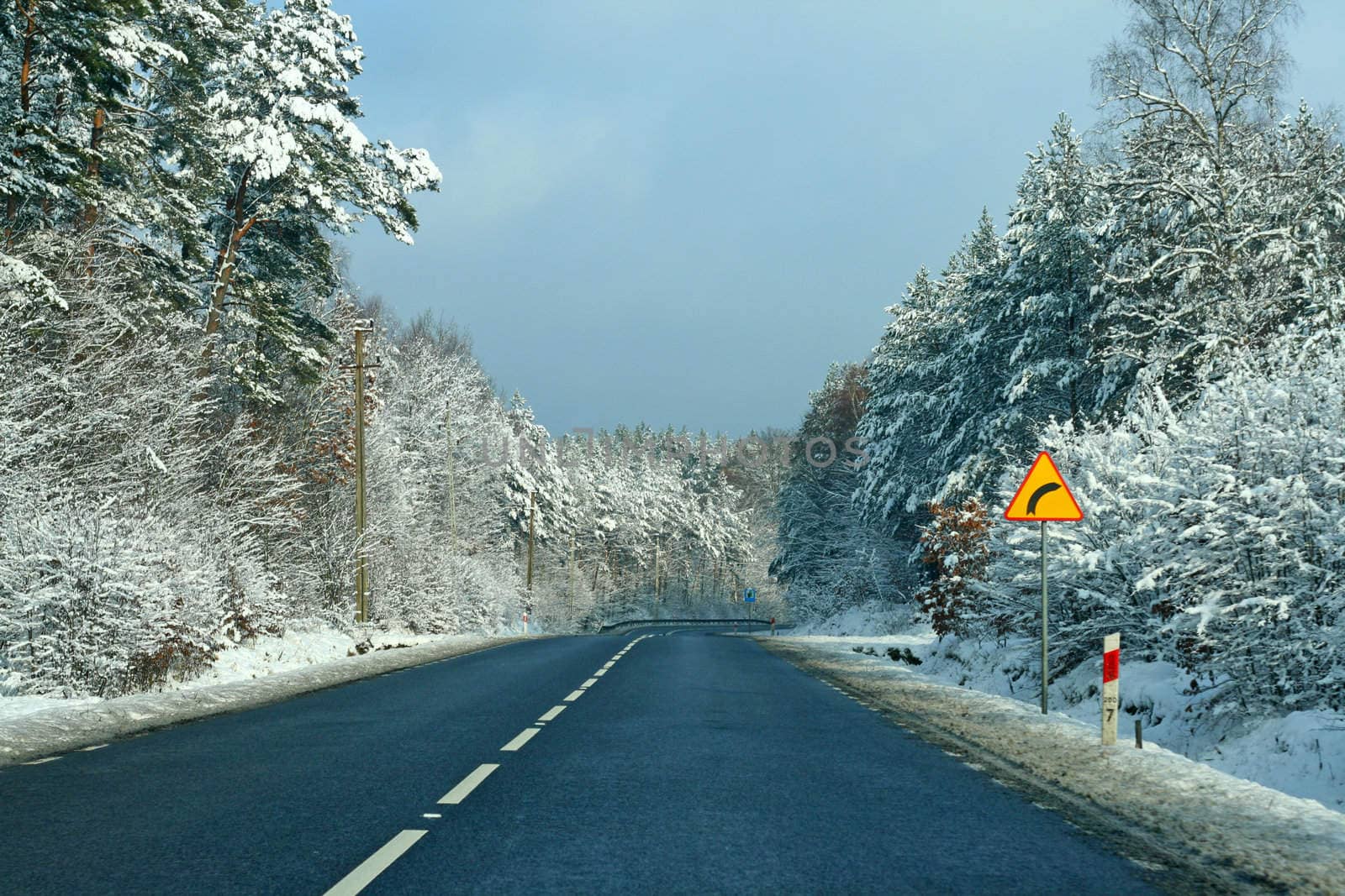 Road with curve ahead, wintertime