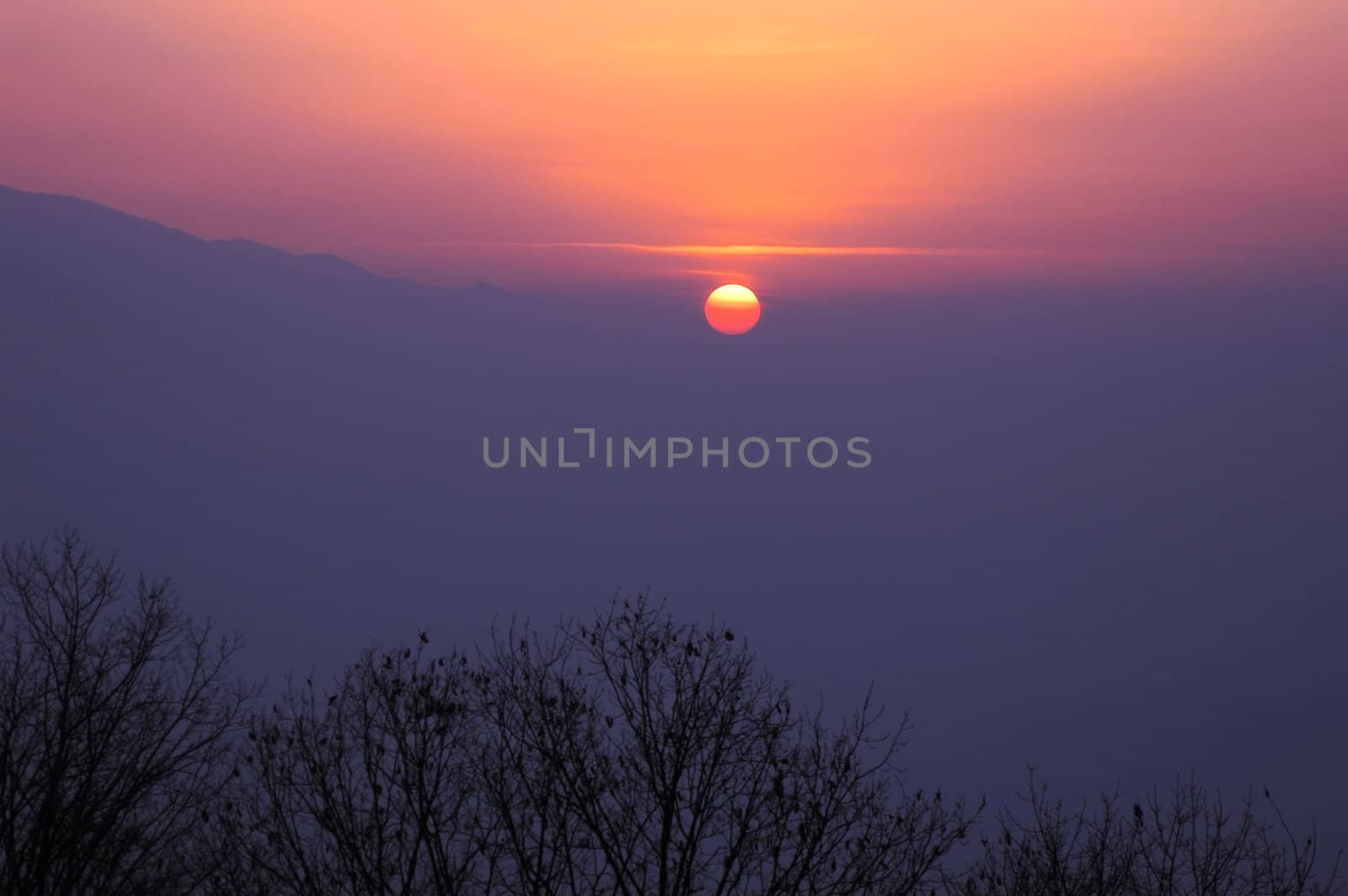 Scenery of sunset at mountains in winter