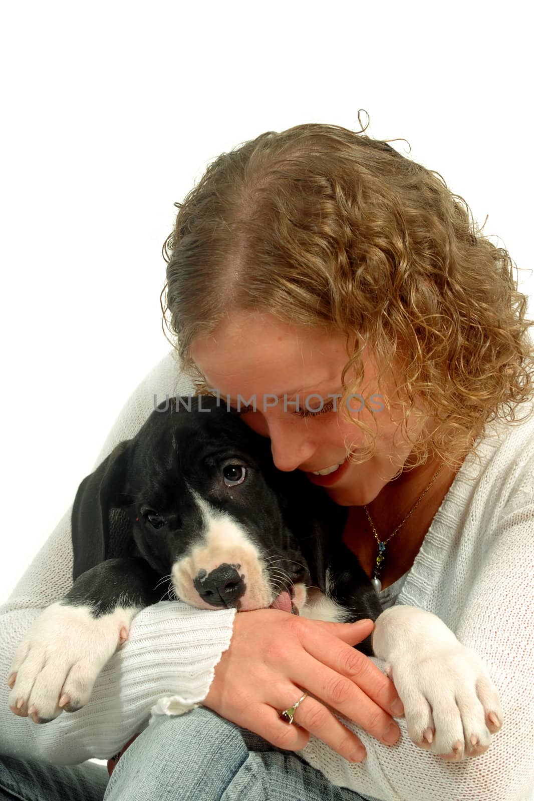 Young woman hugging her puppy by cfoto