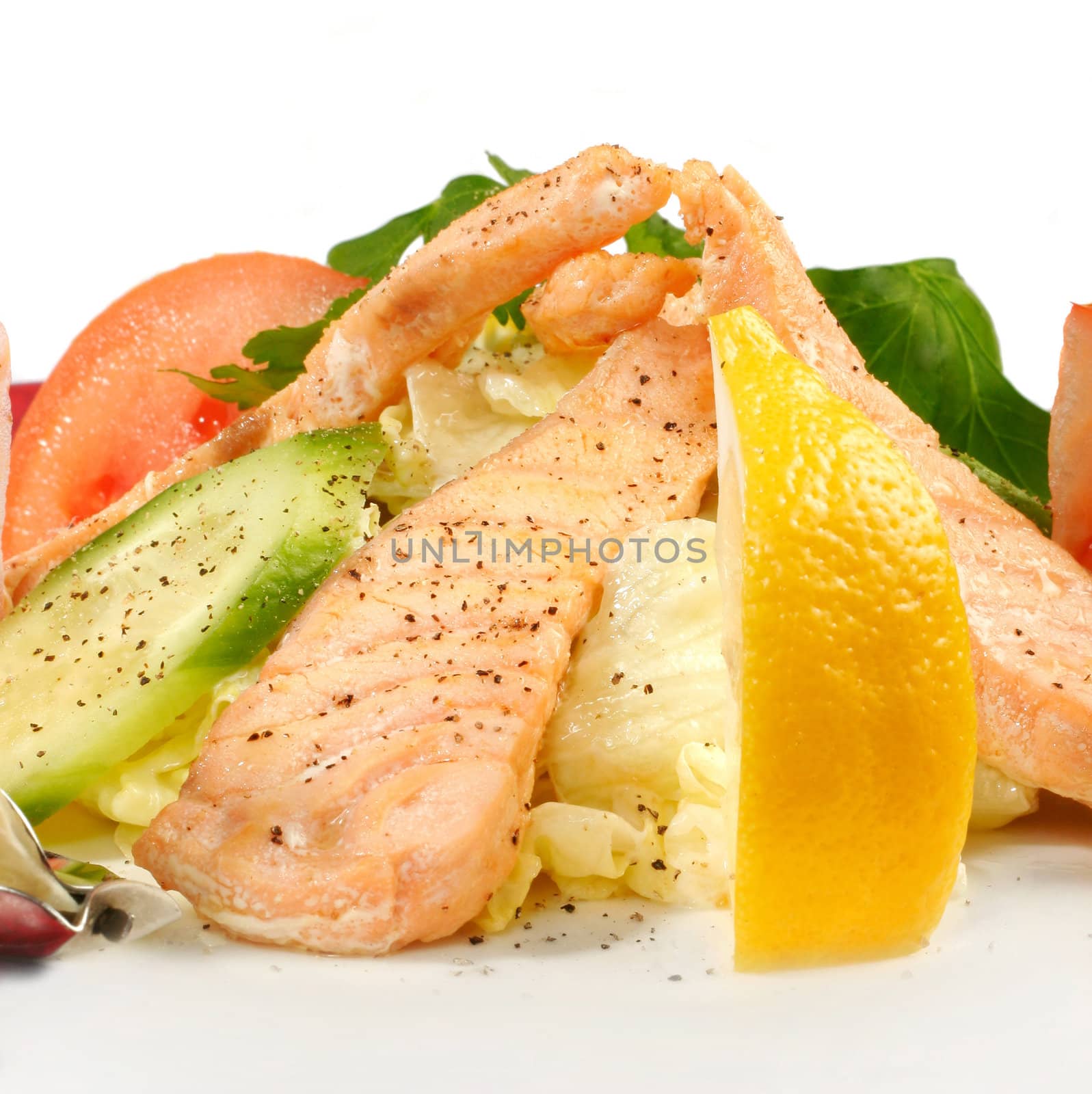 Salmon with vegetables isolated on white. Closeup