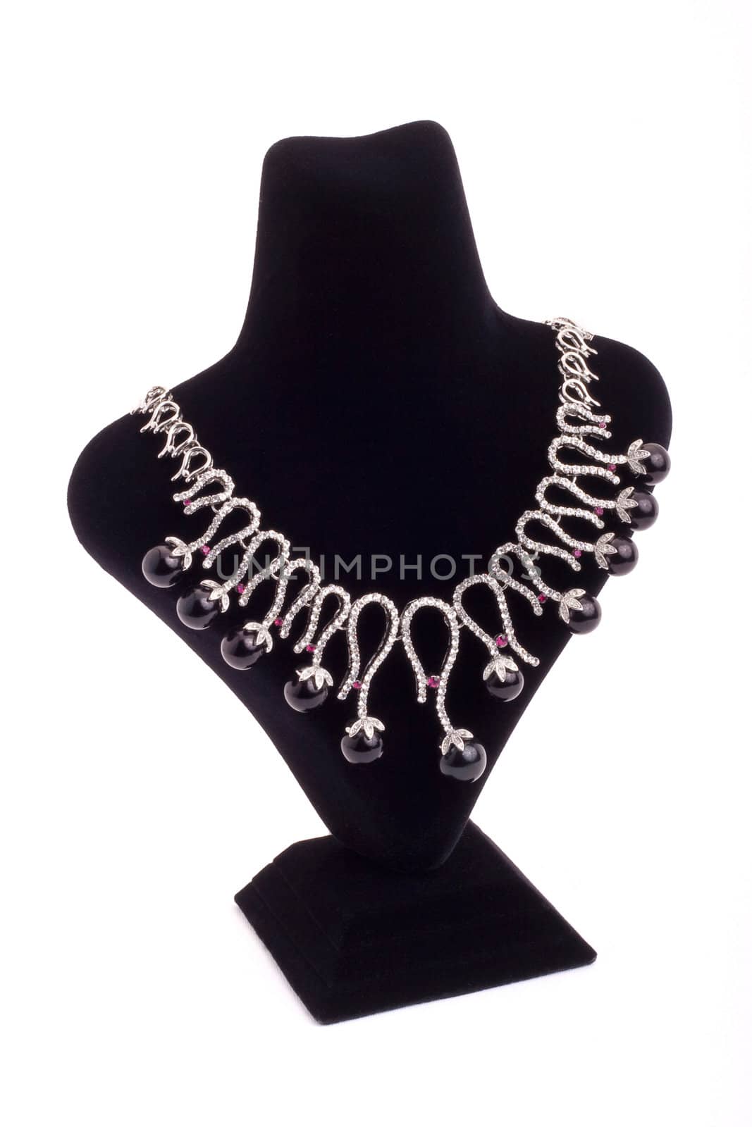 Necklace with black pearls on black stand