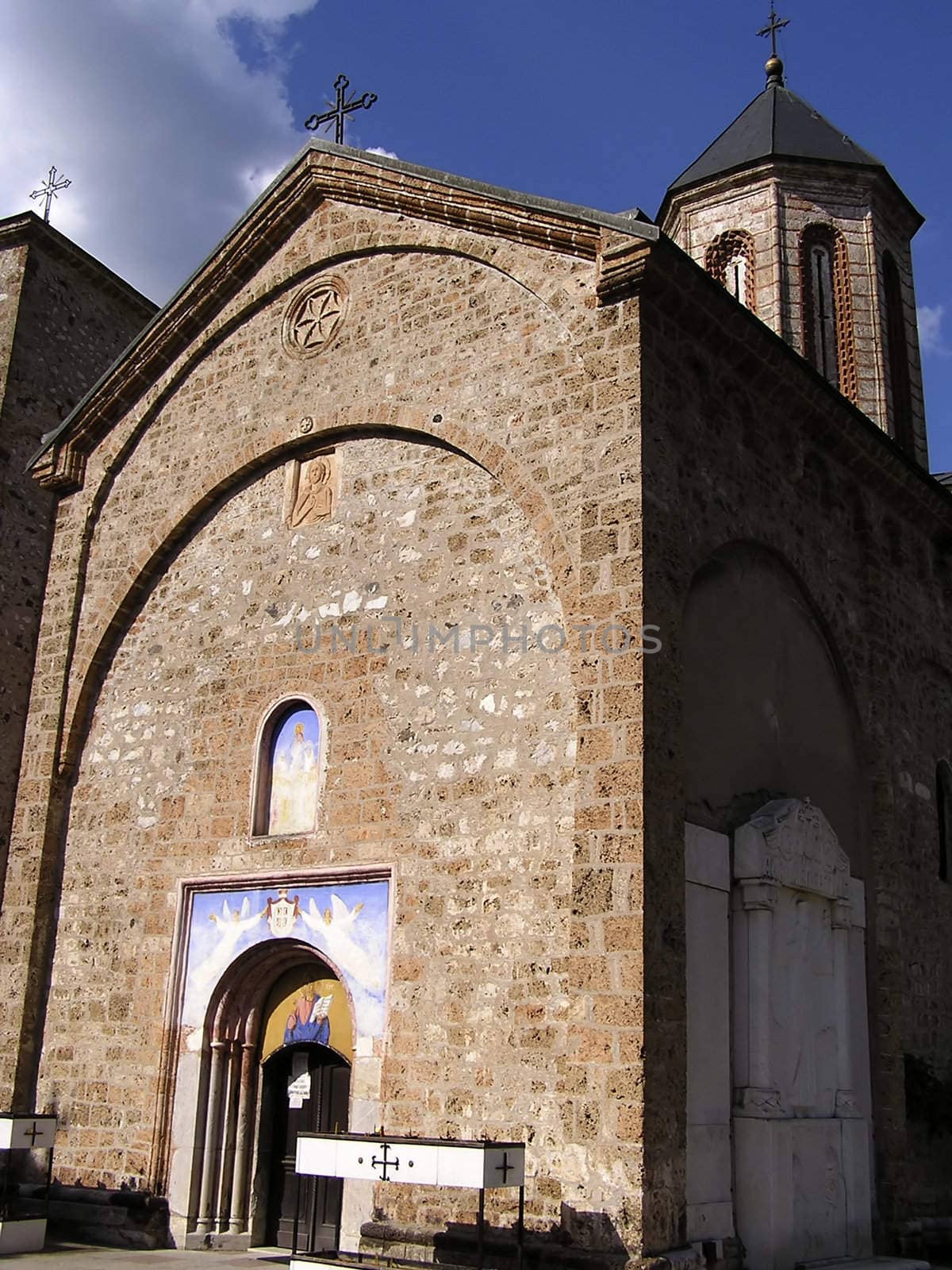 Front view of Raca monastery at Tara mountain in Serbia against clear blue sky.