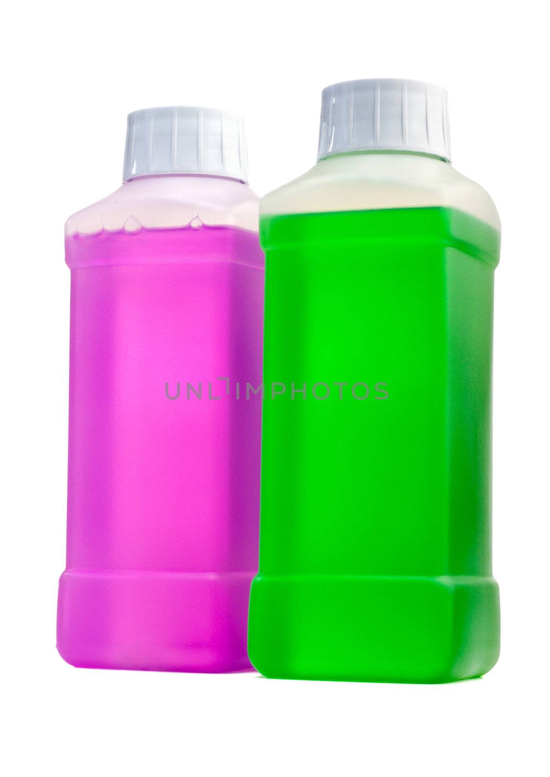 Two transparent plastic bottles with color cleaning liquid. Standing one by one.