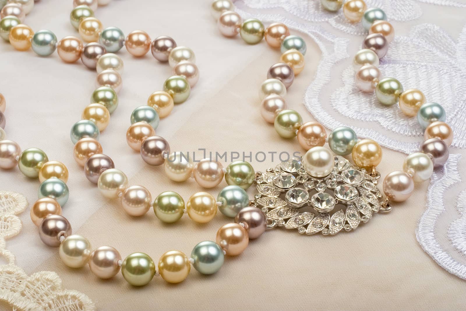 Necklace on lace background closeup
