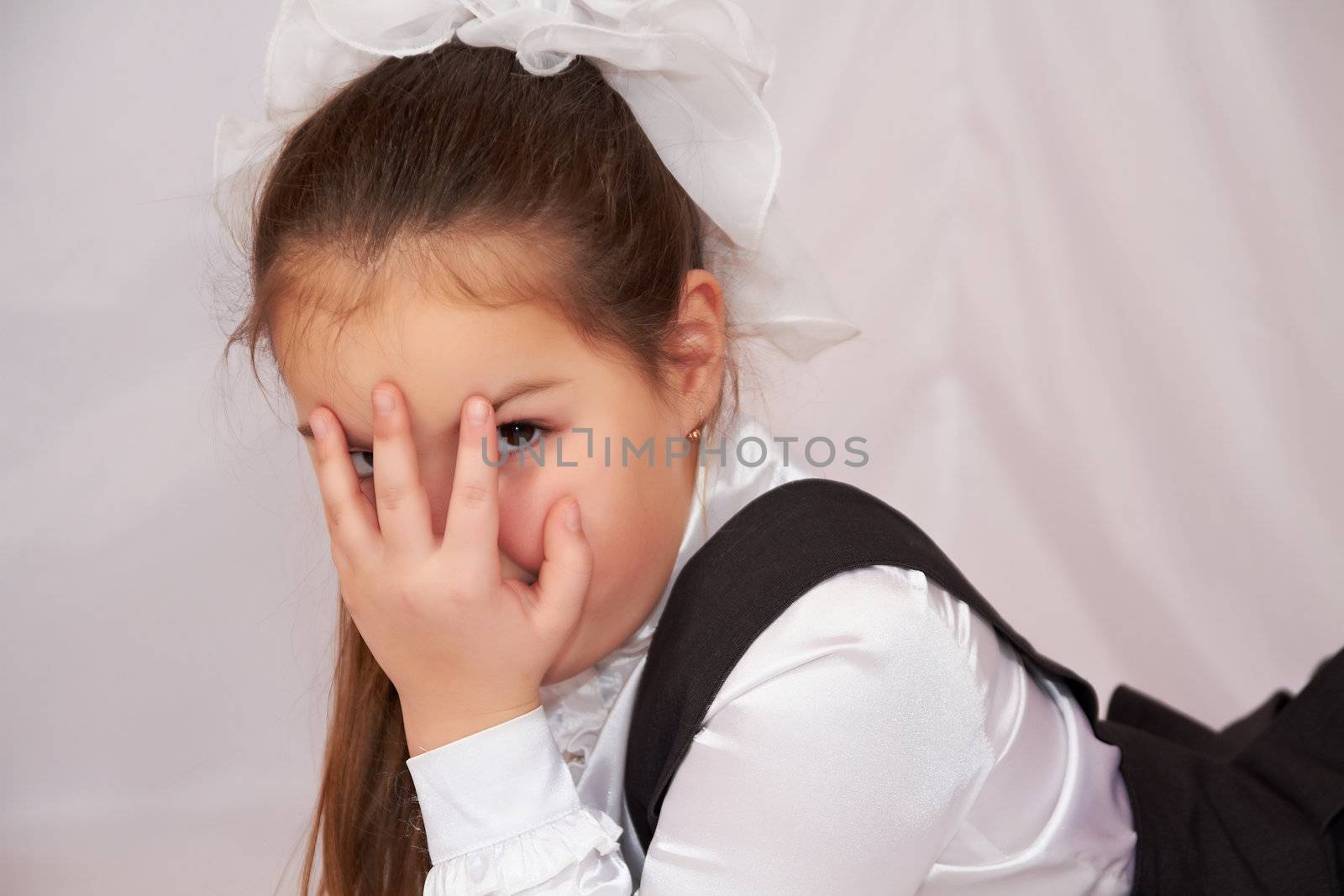 Little girl in school uniform.