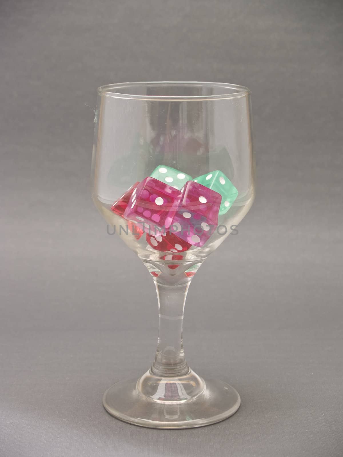  glass cup with dice