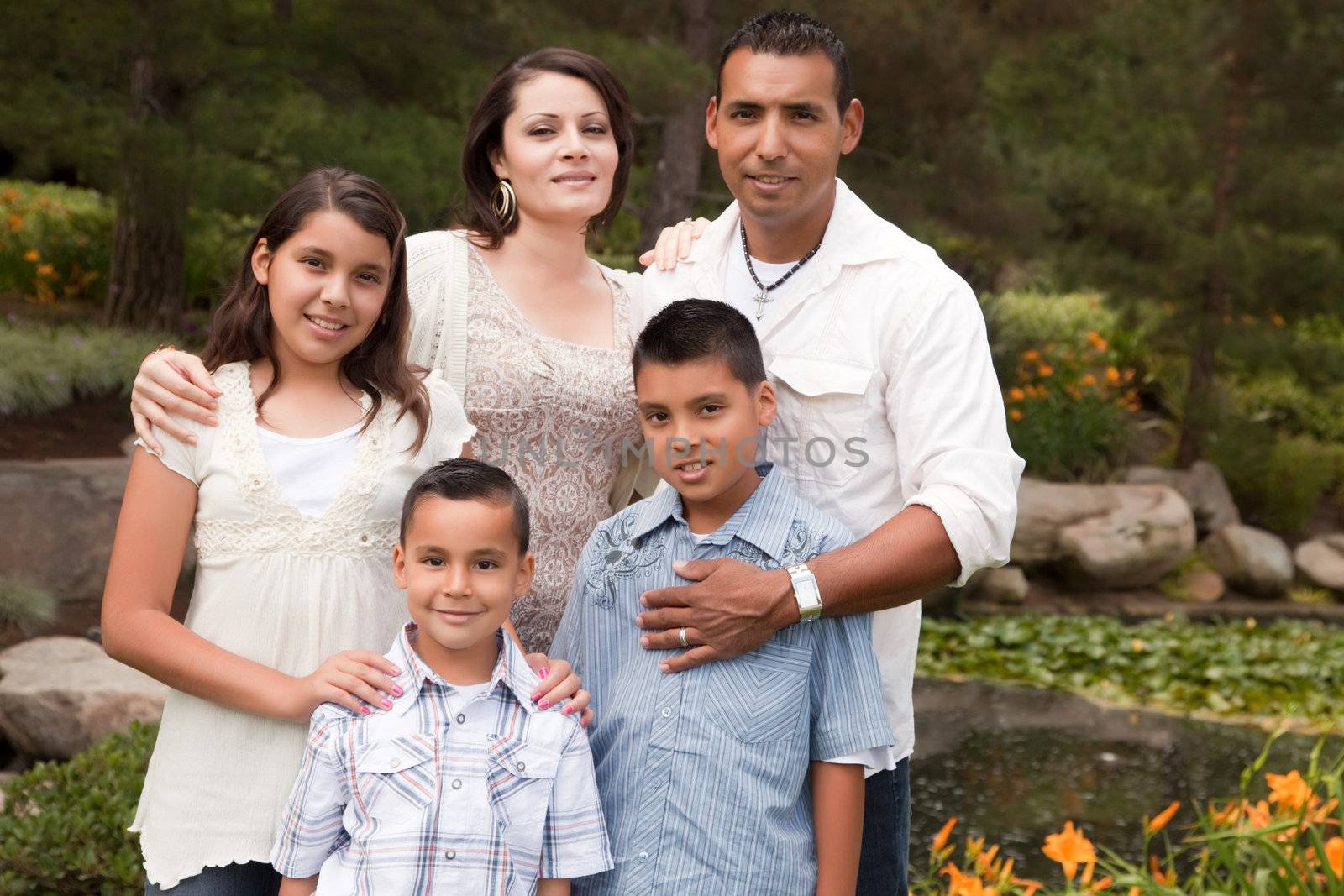 Happy Hispanic Family In the Park by Feverpitched