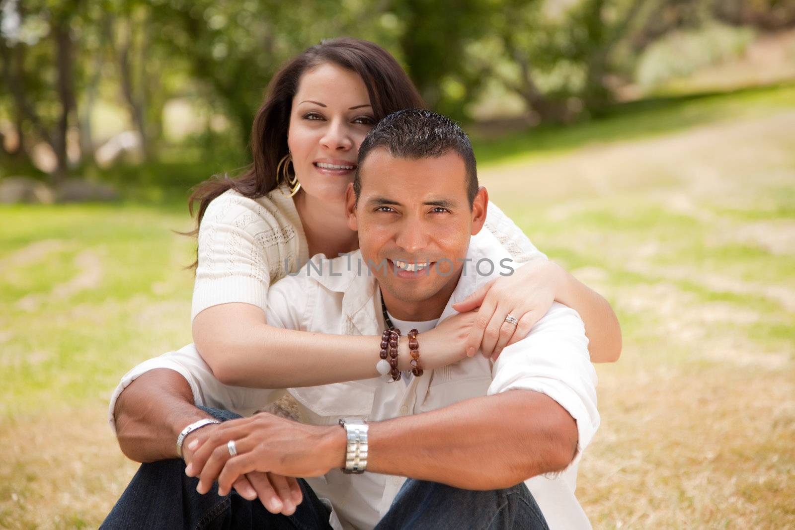 Affectionate Happy Hispanic Couple in the Park.