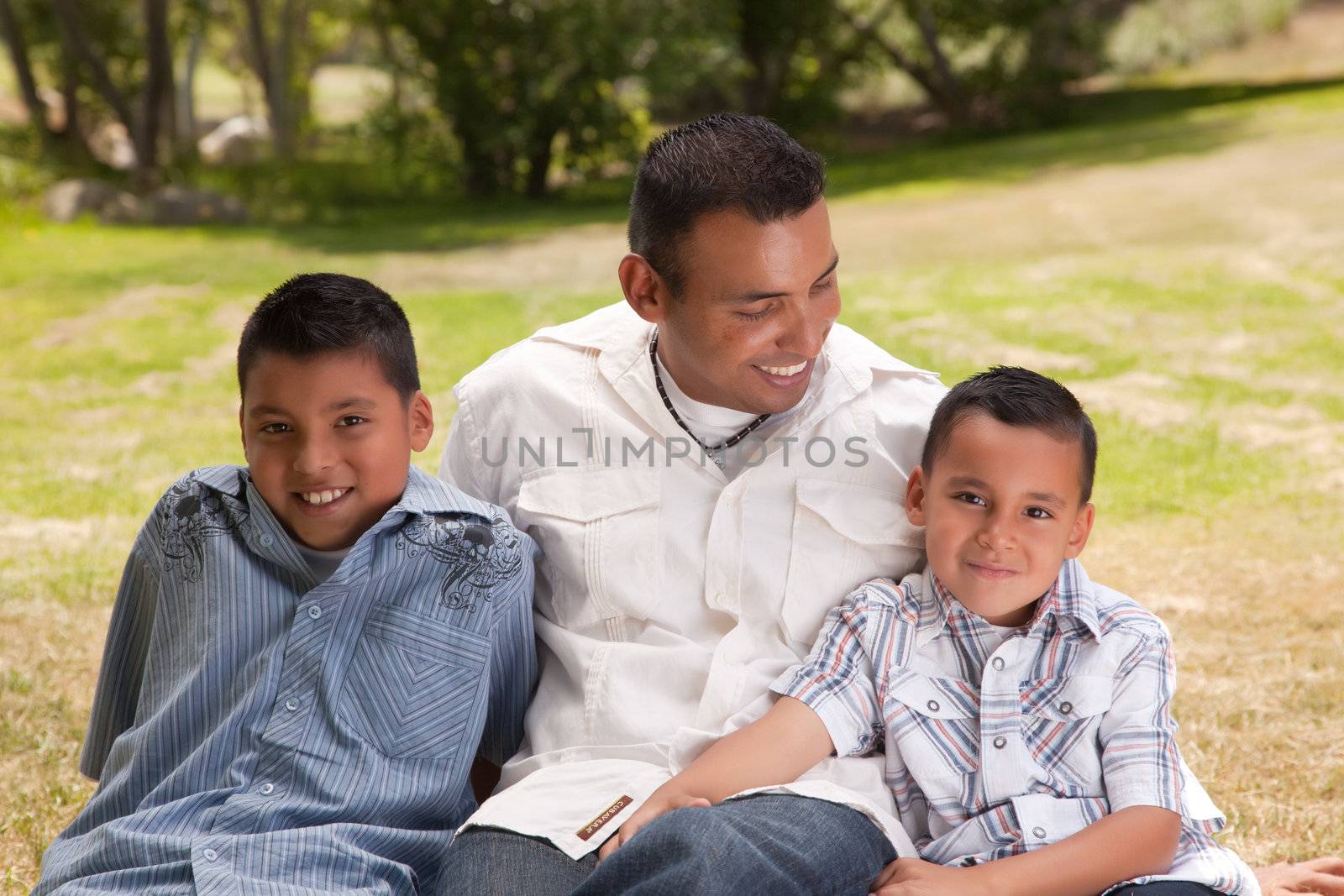 Father and Sons Portrait in the Park.