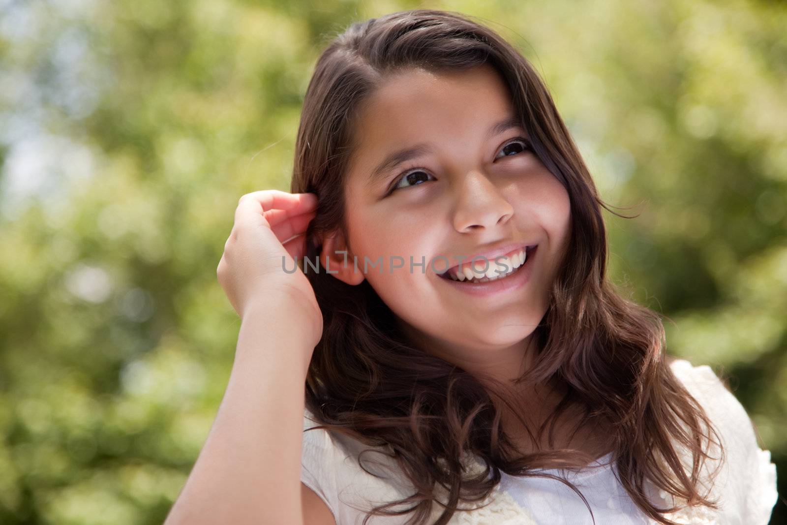 Cute Happy Hispanic Girl in the Park.