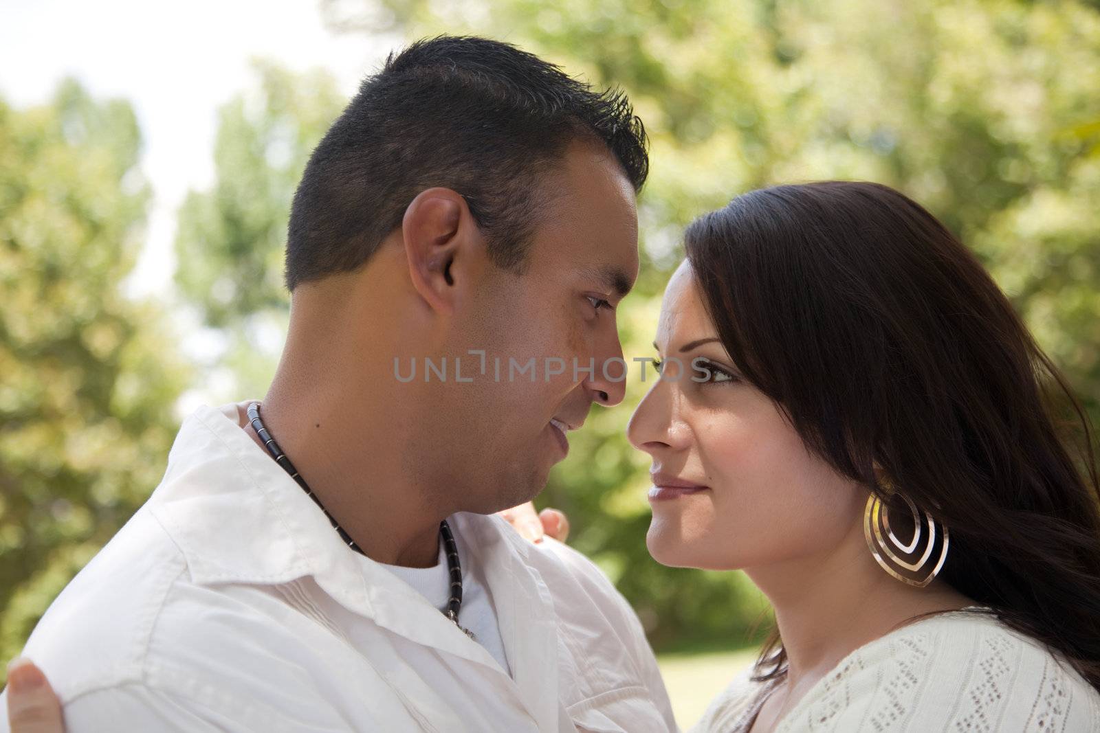 Affectionate Happy Hispanic Couple in the Park.