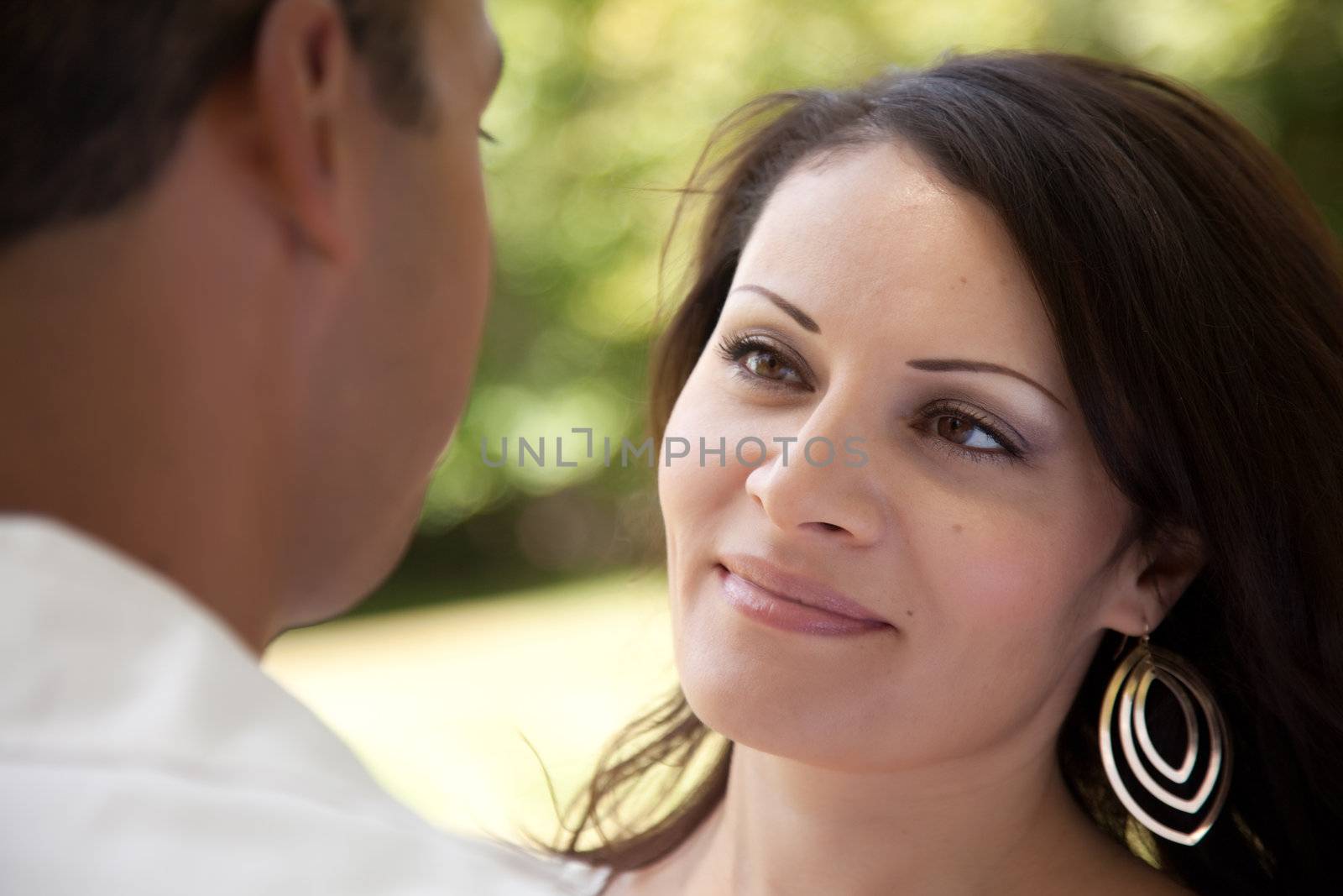 Affectionate Happy Hispanic Couple in the Park.