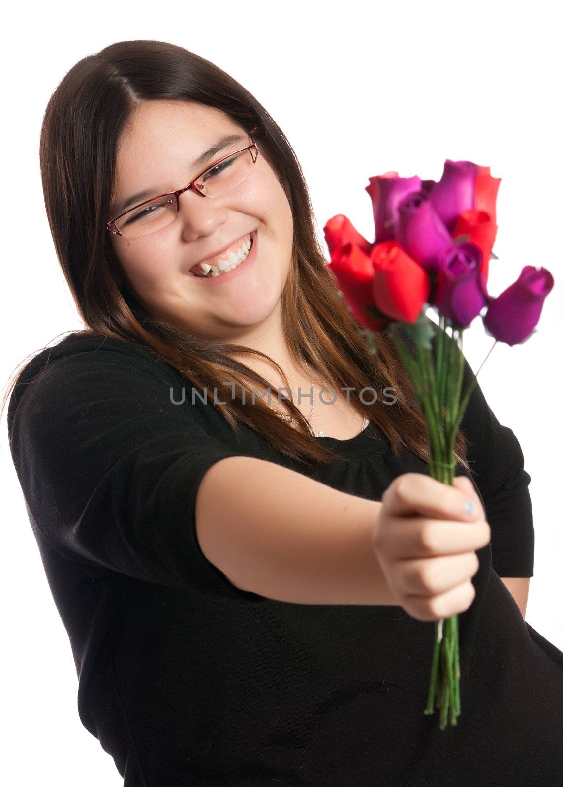 A young girl is either giving or receiving a small bouquet of roses, isolated against a white background.