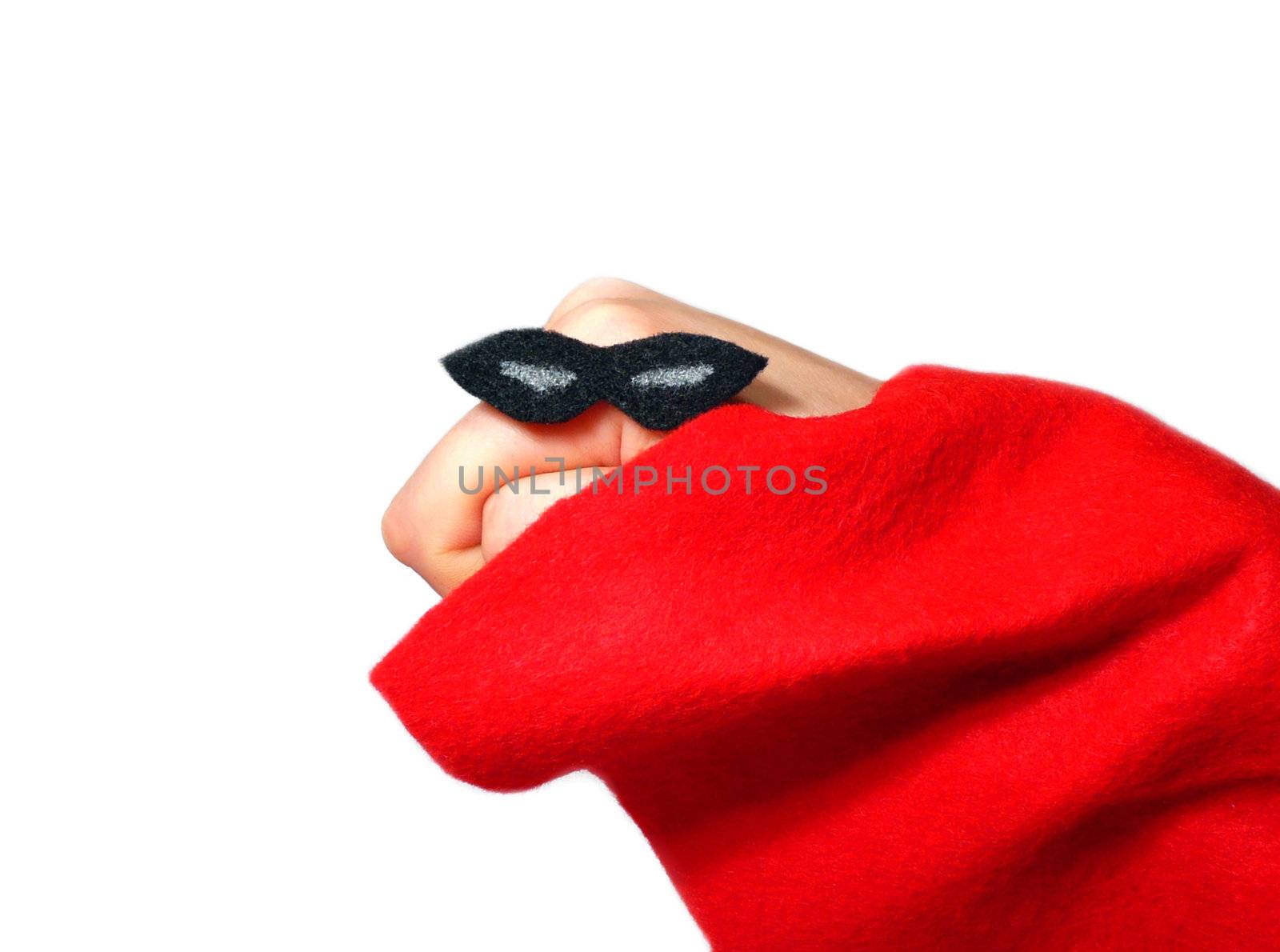 Hand puppet dressed in a super hero costume over a white background