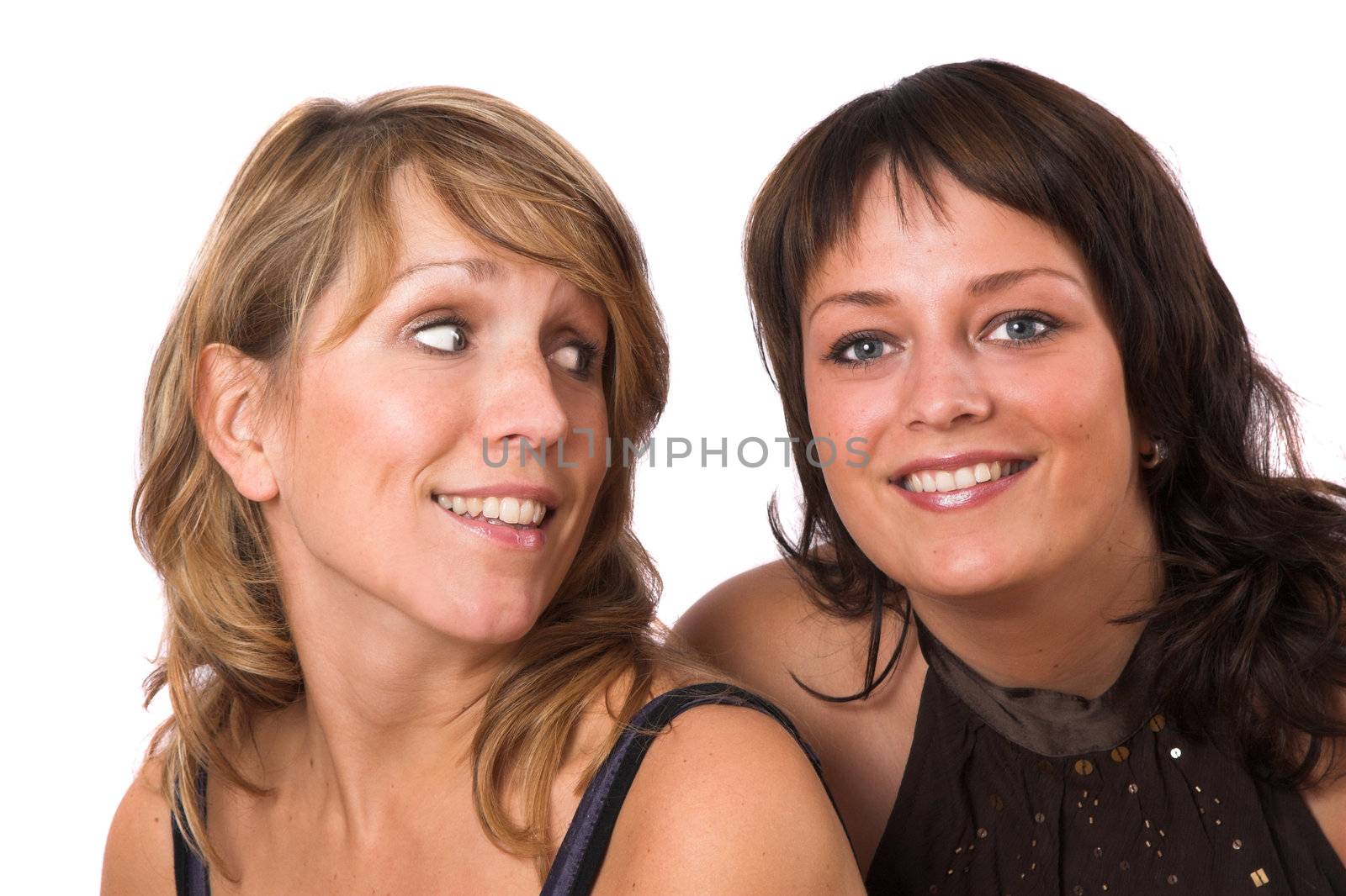 Two sisters posing together on white background