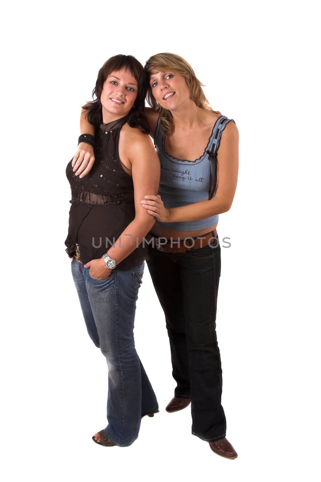 Two sisters standing on white background, full lenght body shot