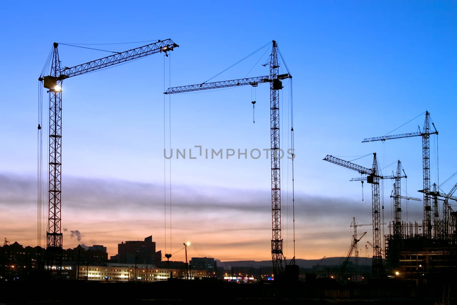 Kind on construction in the evening on a background of the sky