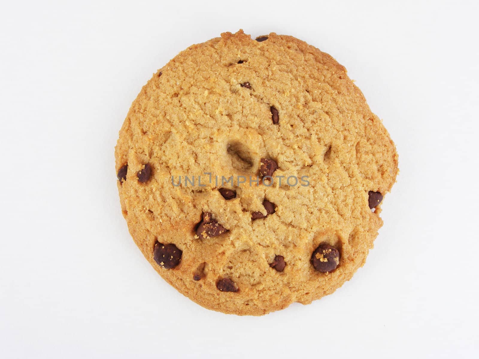 Chocolate chip cookie against an off-white background.