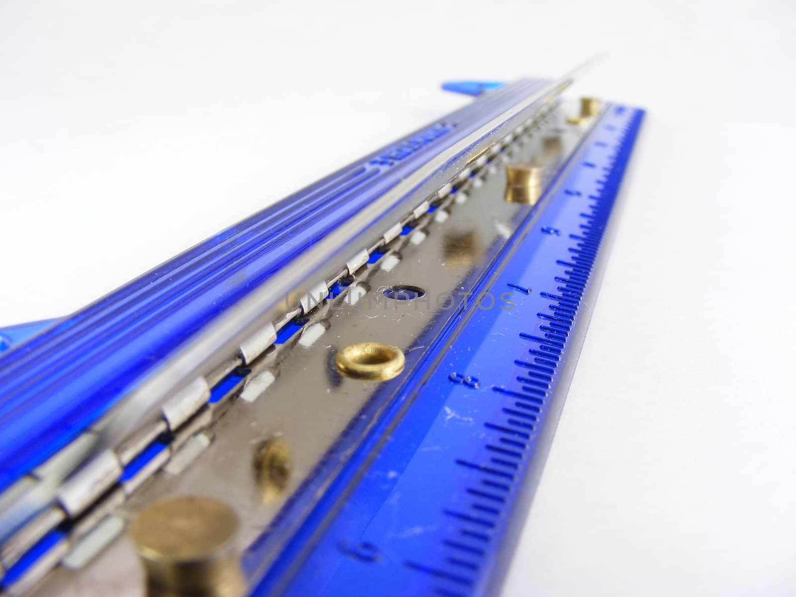 A blue plastic 3-hole paper puncher against a white background.