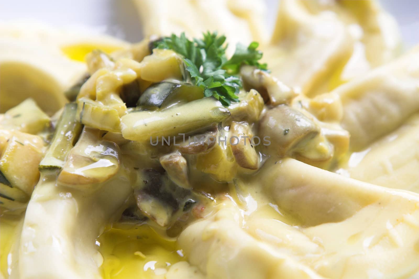 Delicious pasta dish with filled pasta, mushrooms, courgette made in a sauce of cream and oliveoil and herbs