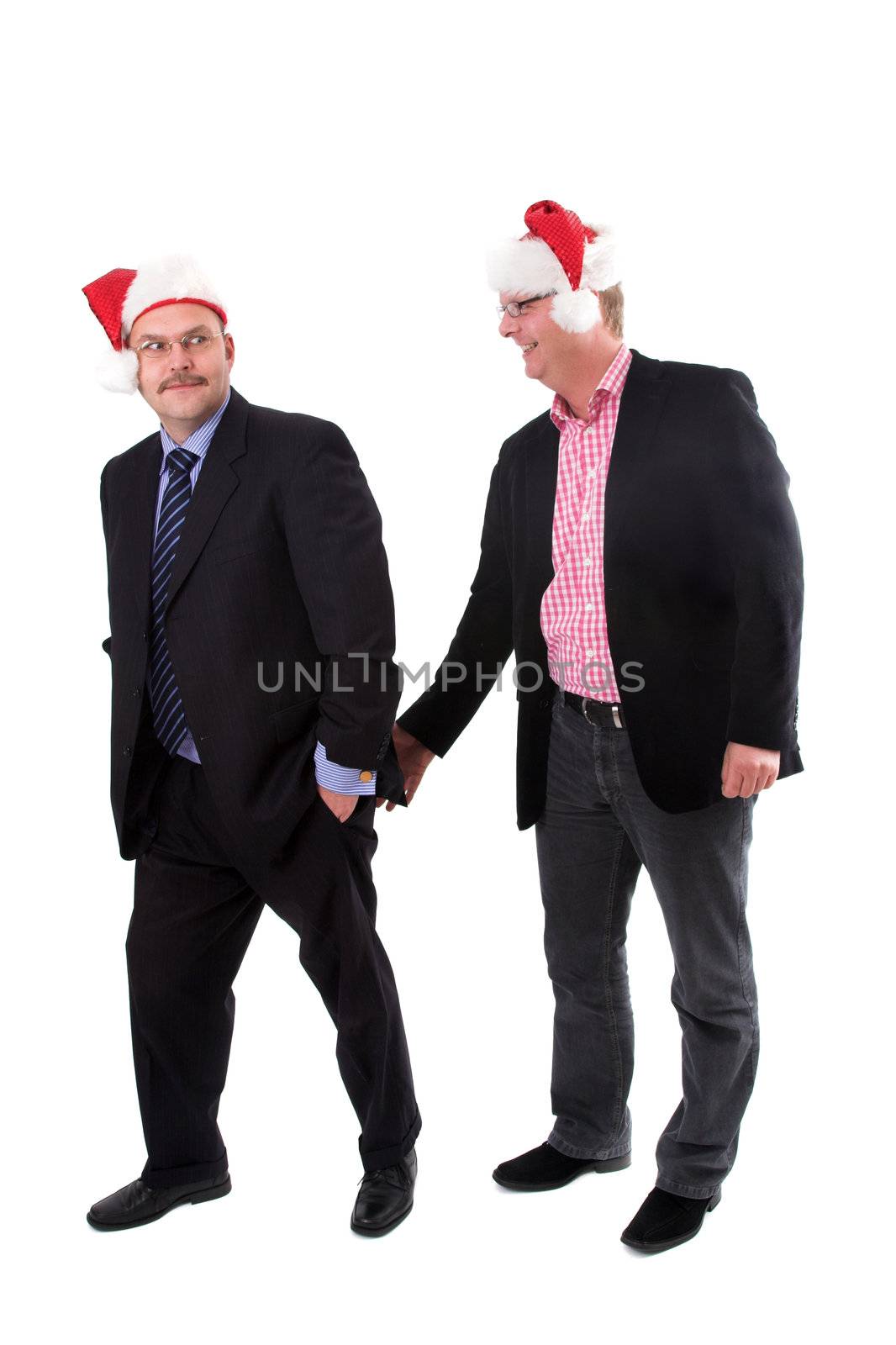 Two businessman at a christmas party while one is pinching the other in the butt